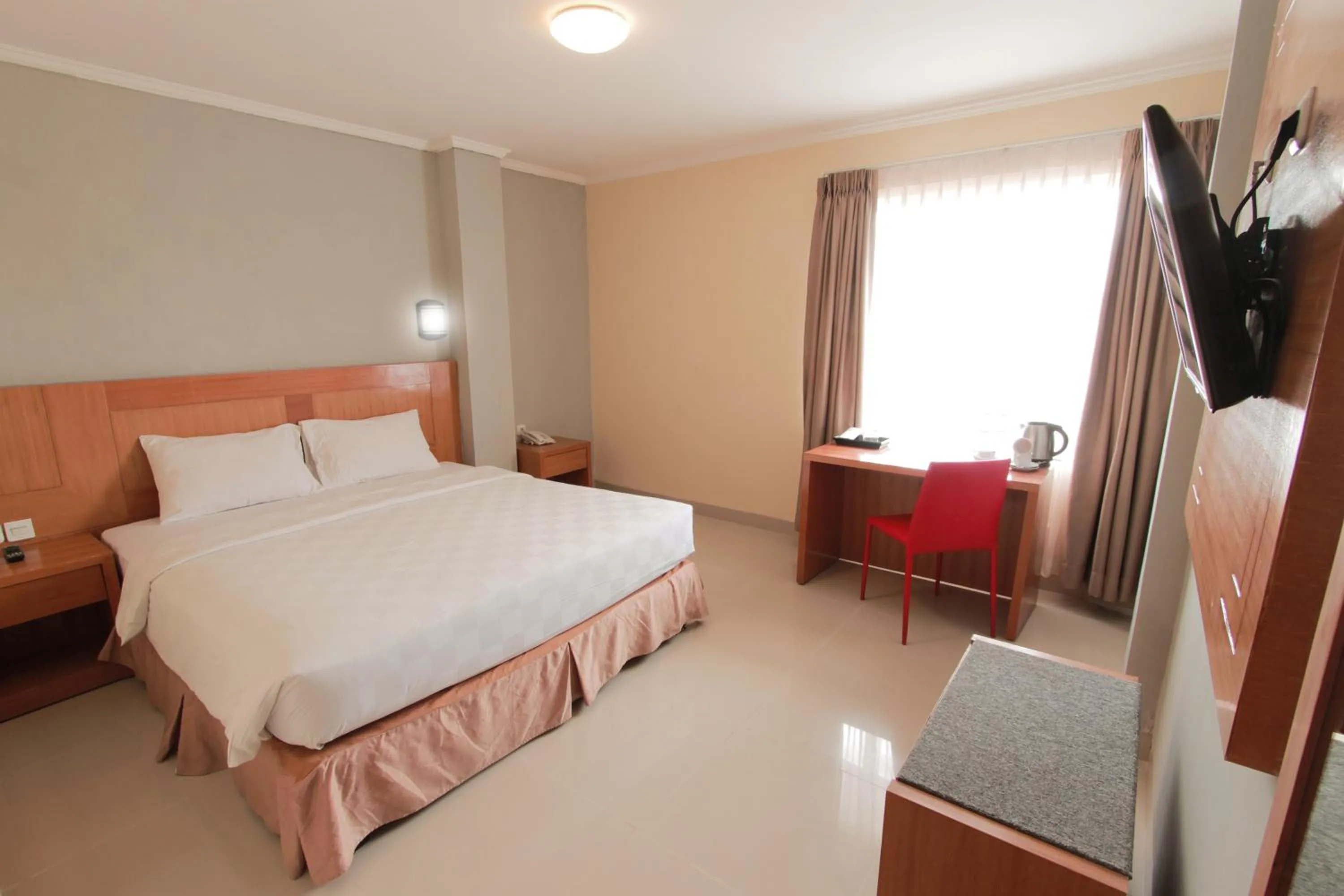 Bedroom in Maleosan Inn Manado Hotel