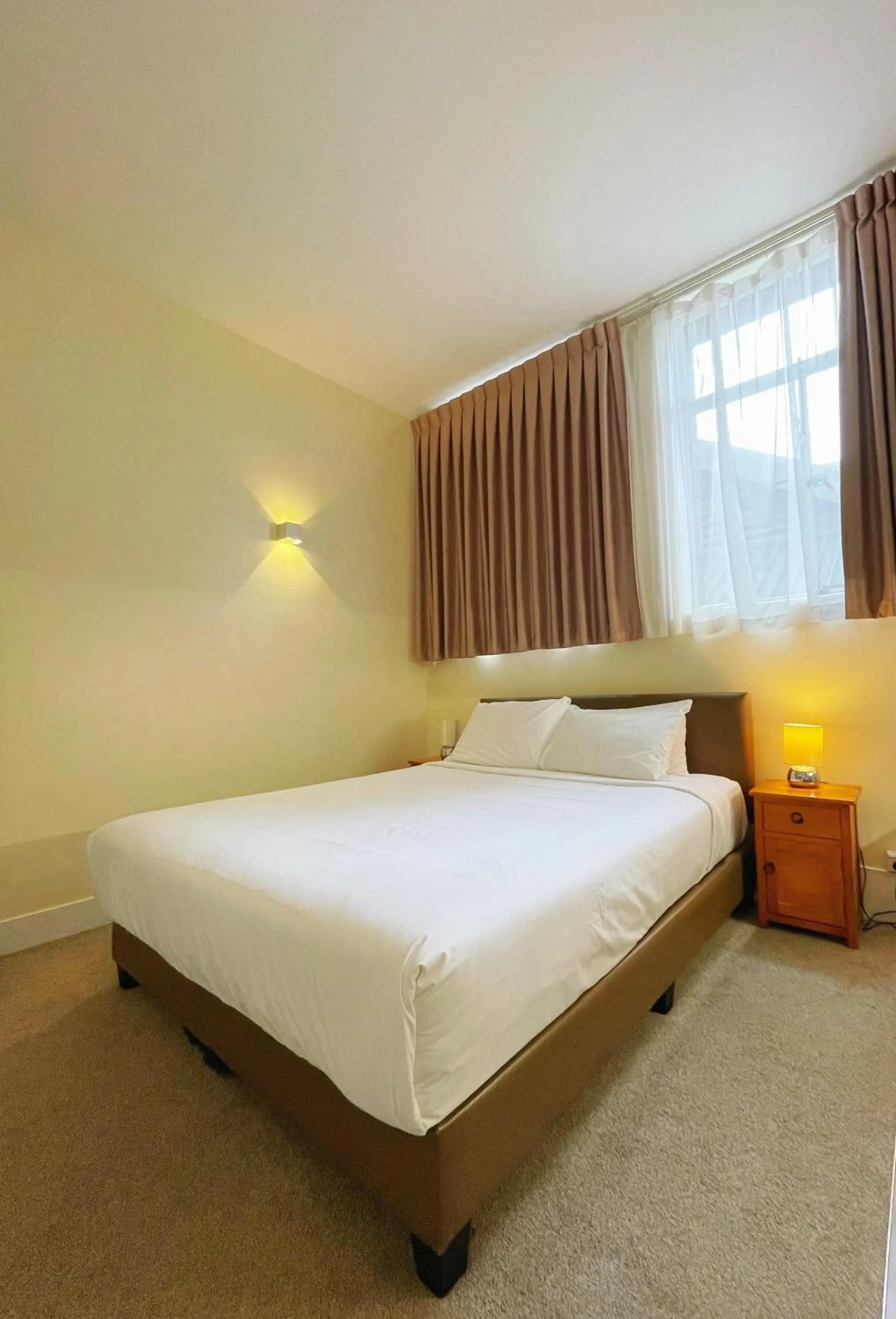 Bed in Grand Central Serviced Apartments