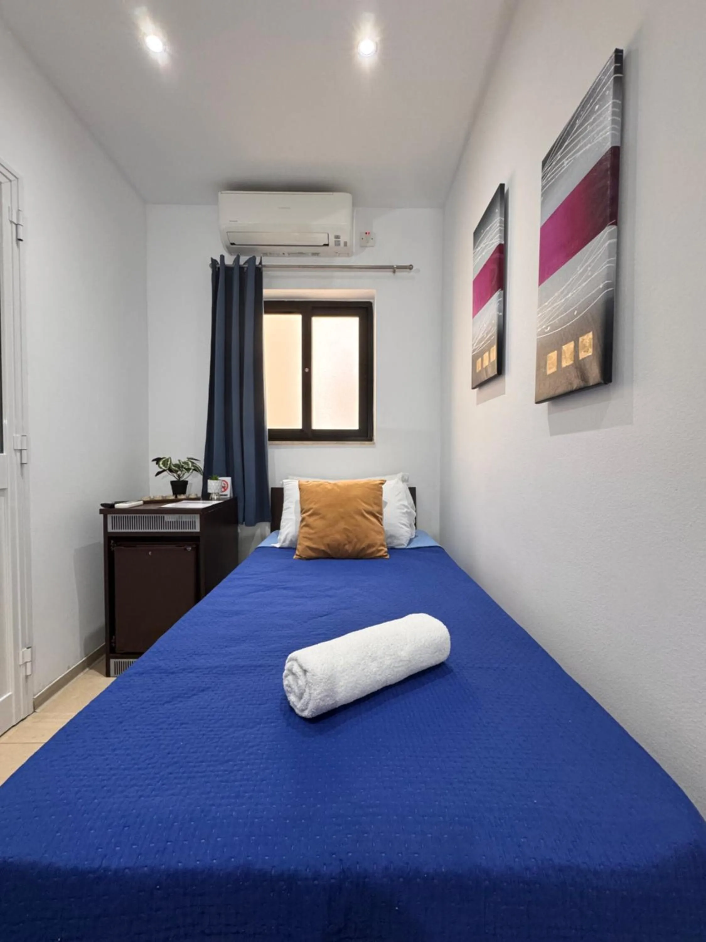 Bed in Allegro Hotel