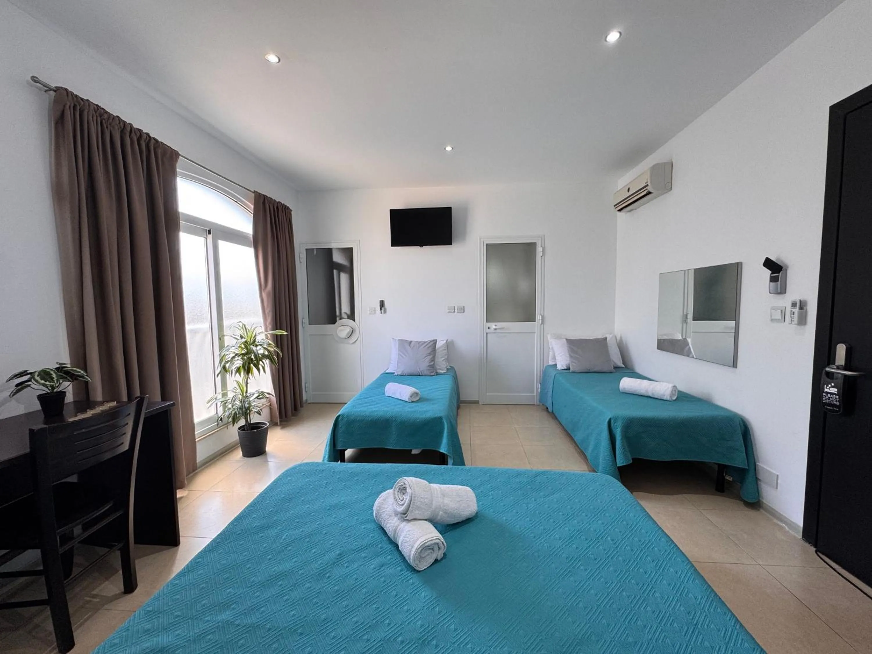 Bed in Allegro Hotel