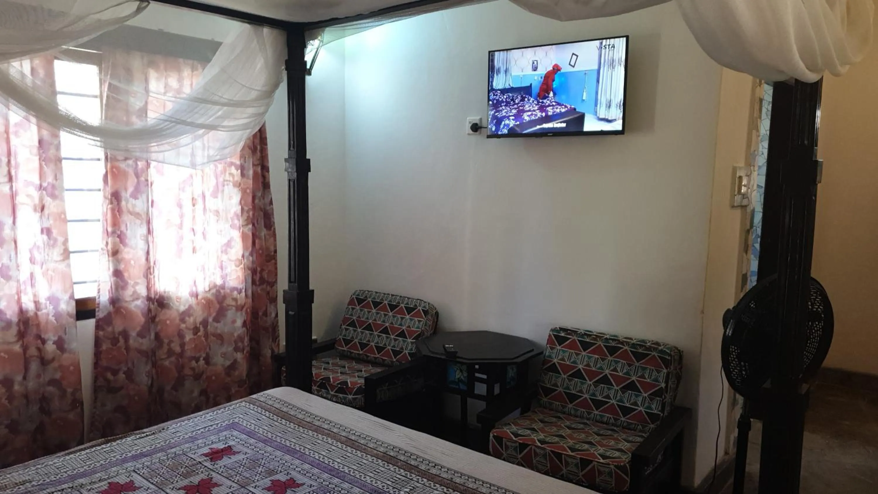 Communal lounge/ TV room, Bed in Marijani Holiday Resort