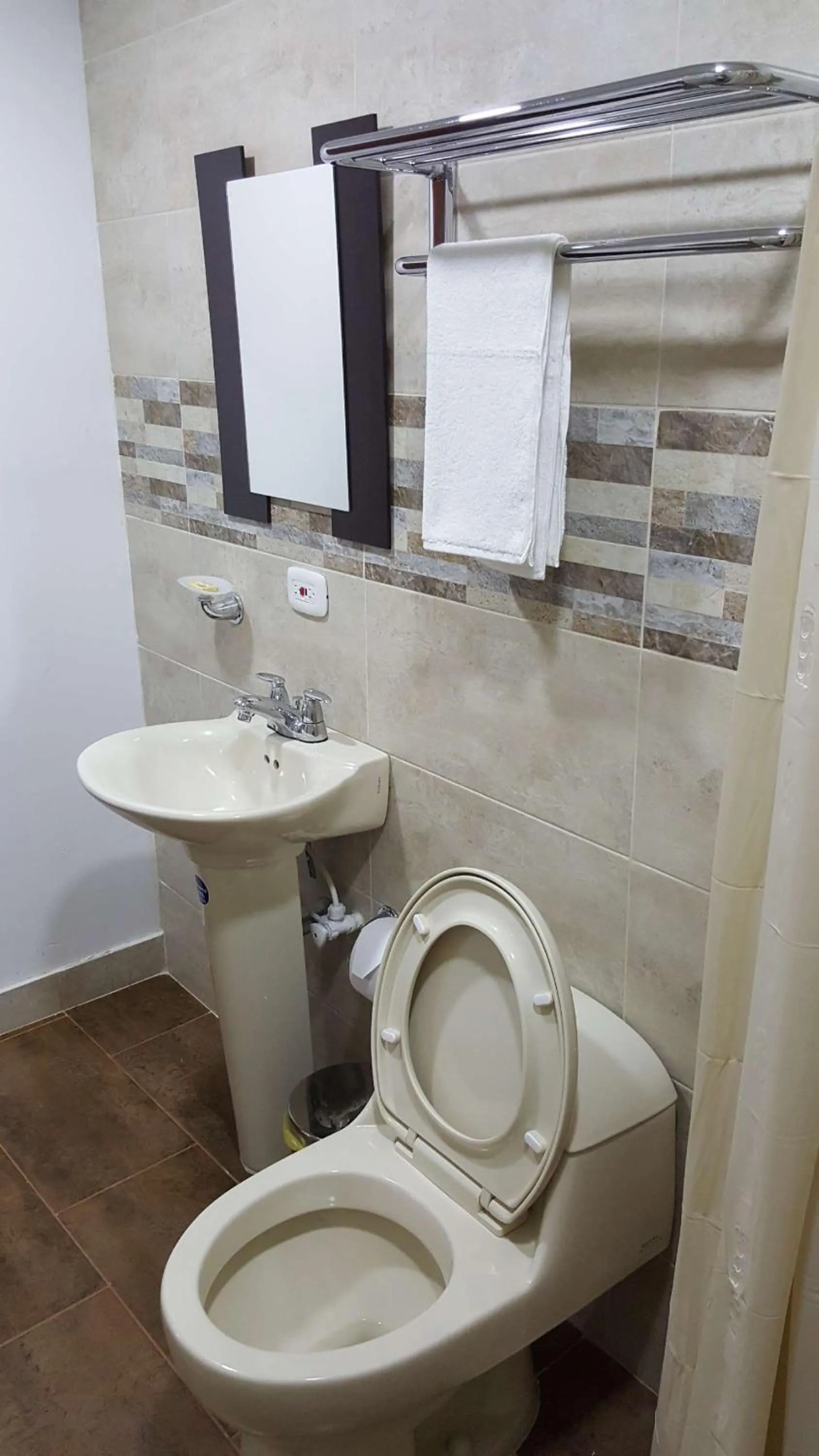 Shower in Beach Paradise Apartments