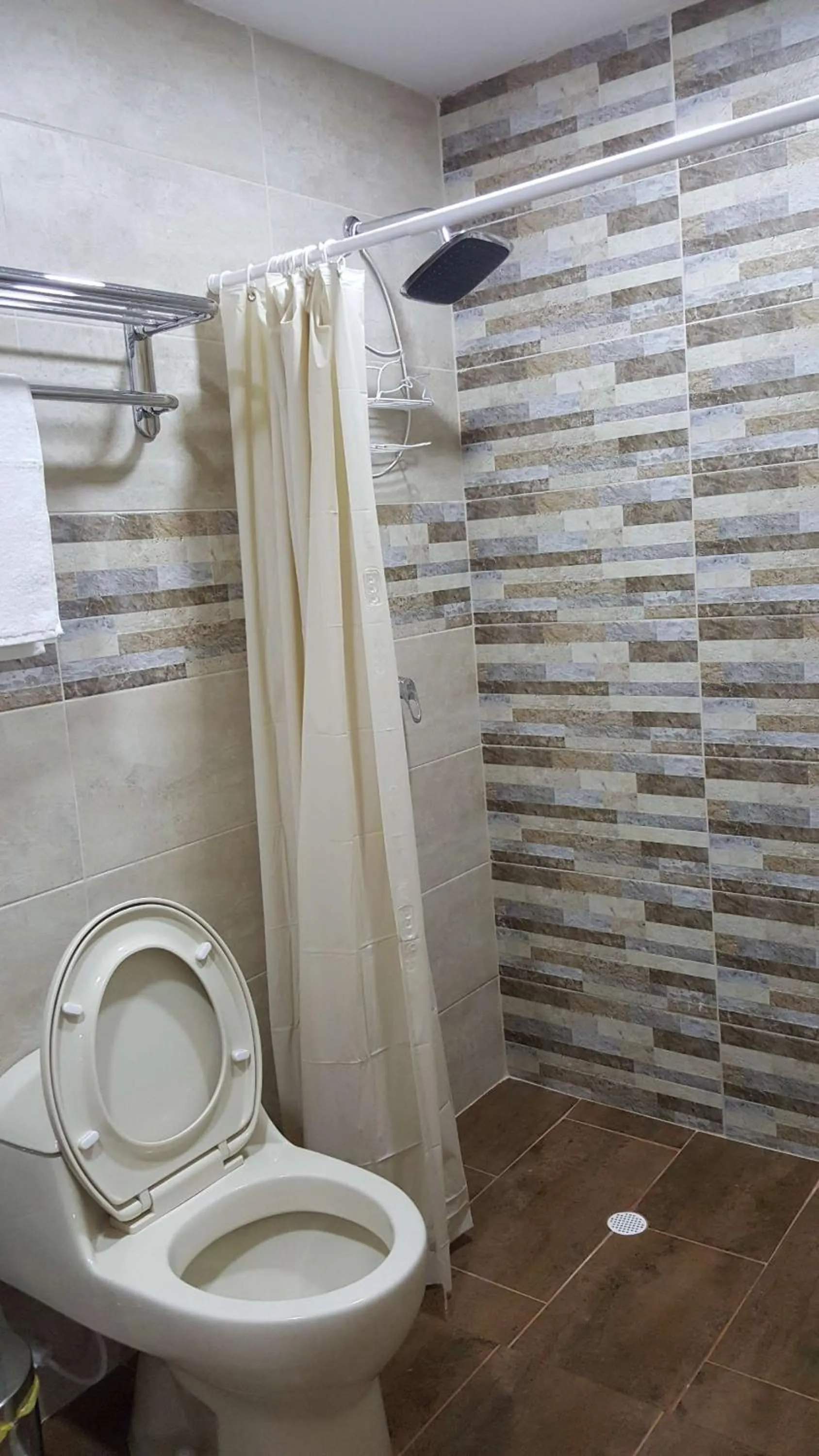 Shower in Beach Paradise Apartments