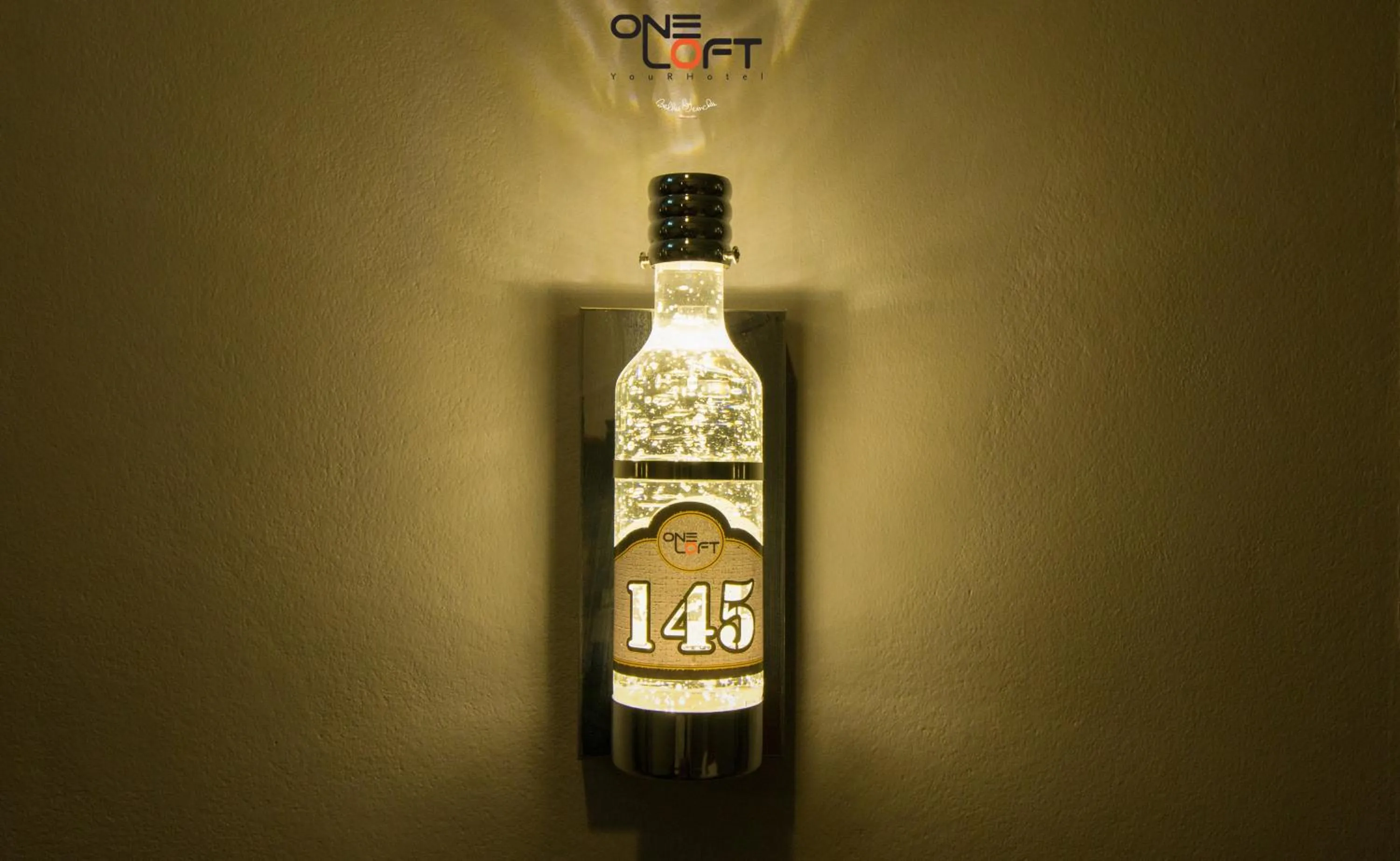 Property logo or sign in OneLoft Hotel