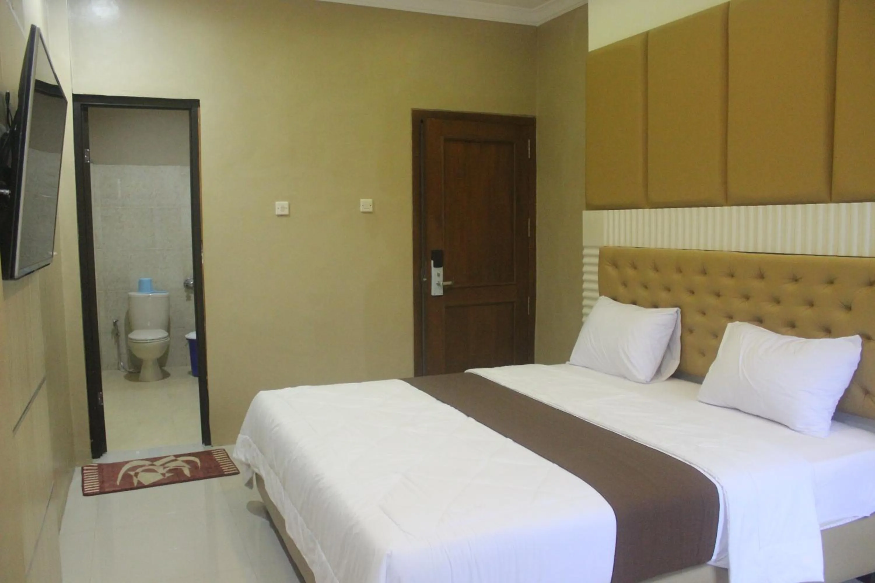 Bed in Cyka Raya Hotel