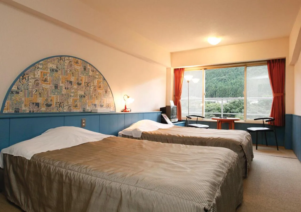 Bed in Tabist Kinugawa Park Cottage