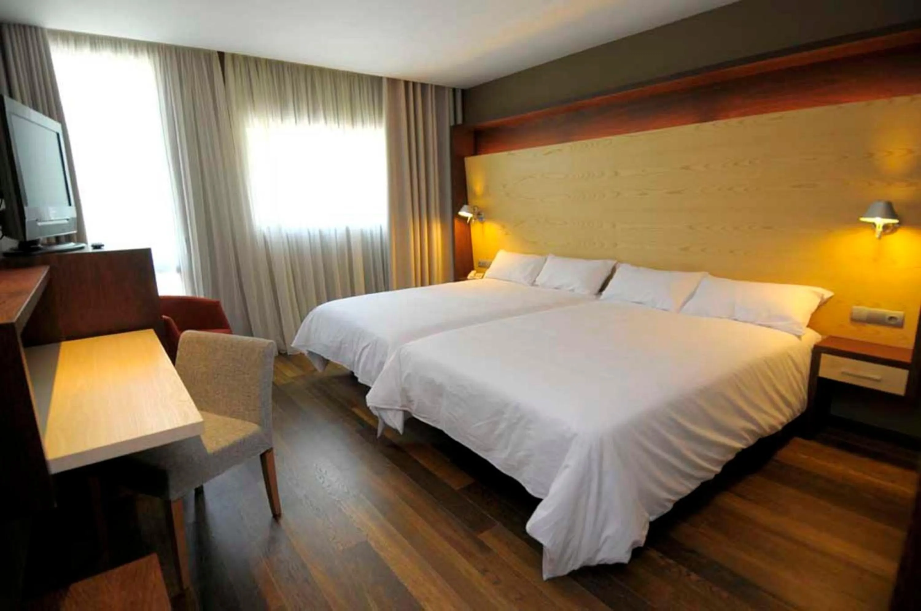 Bed in SOMMOS Hotel Aneto