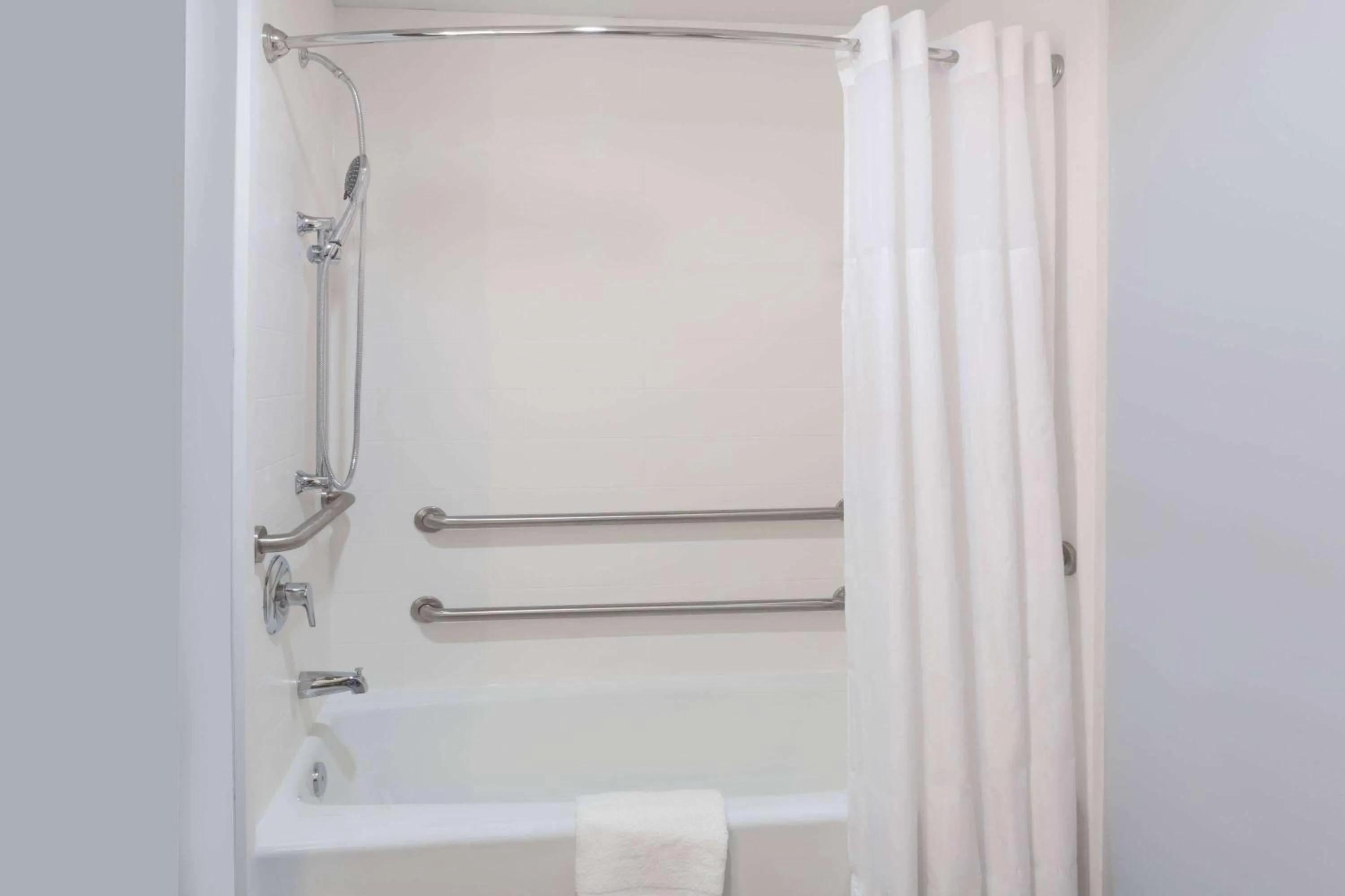 Bathroom in Days Inn & Suites by Wyndham Houston NW Cypress