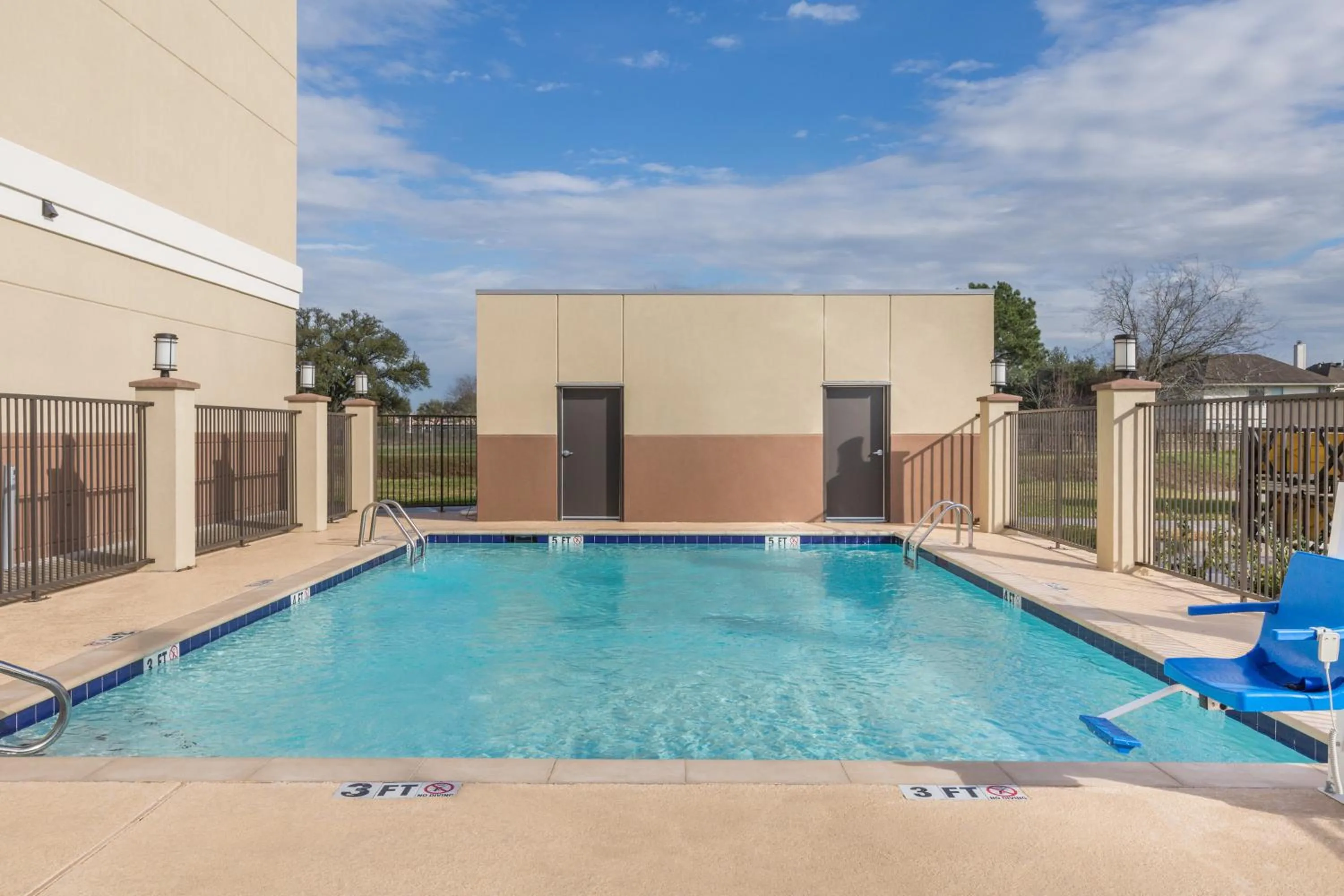 Swimming pool in Days Inn & Suites by Wyndham Houston NW Cypress