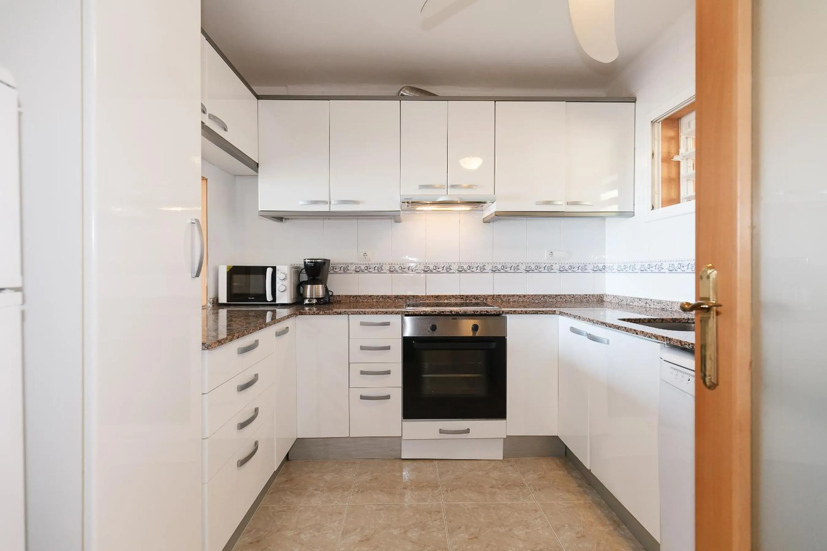 Kitchen or kitchenette in UHC Arco del Sol Family Complex