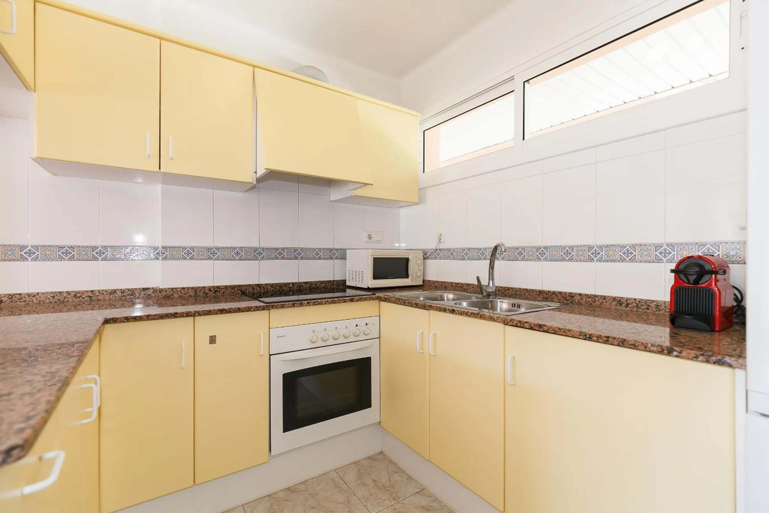 Kitchen or kitchenette in UHC Arco del Sol Family Complex