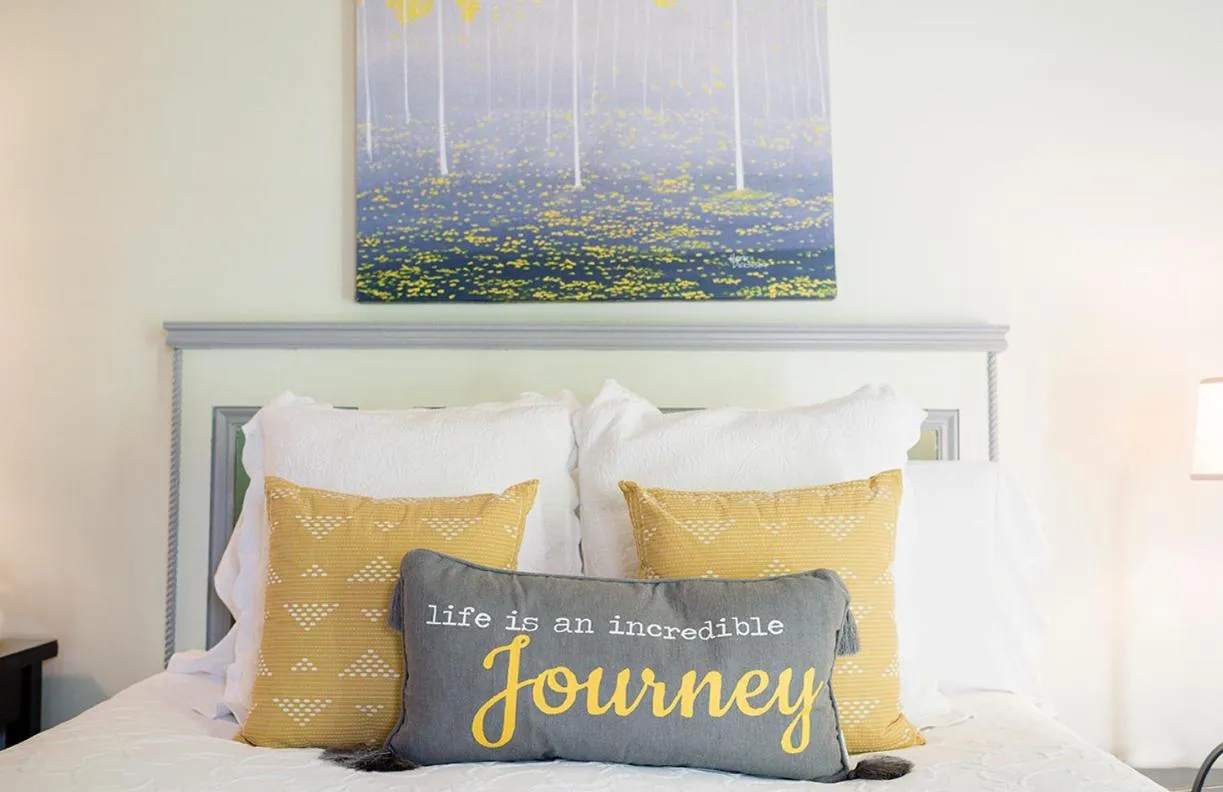 Bed in 1801 First Luxury Inn