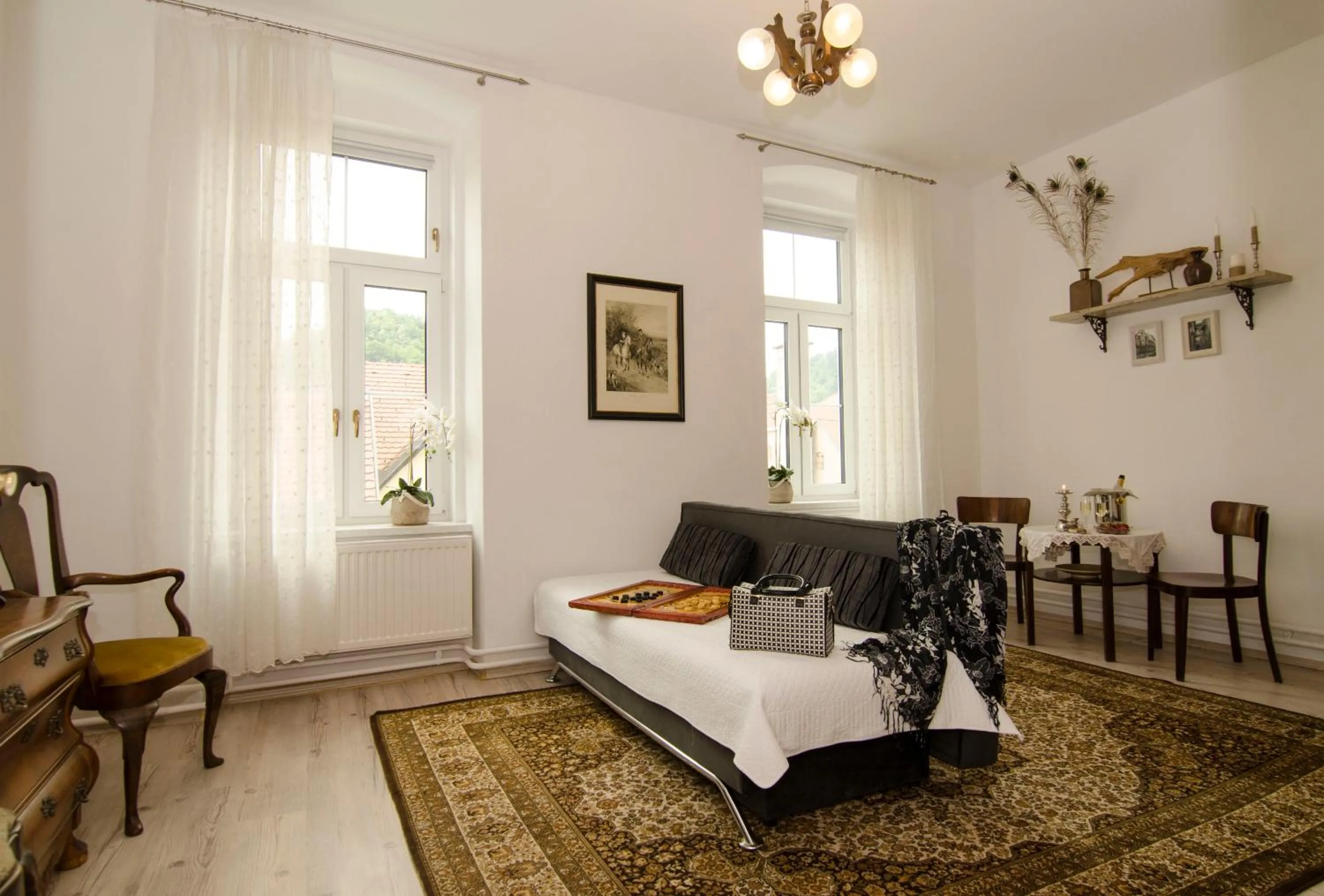 Seating area, Bed in Trubarjev Art Boutique hotel