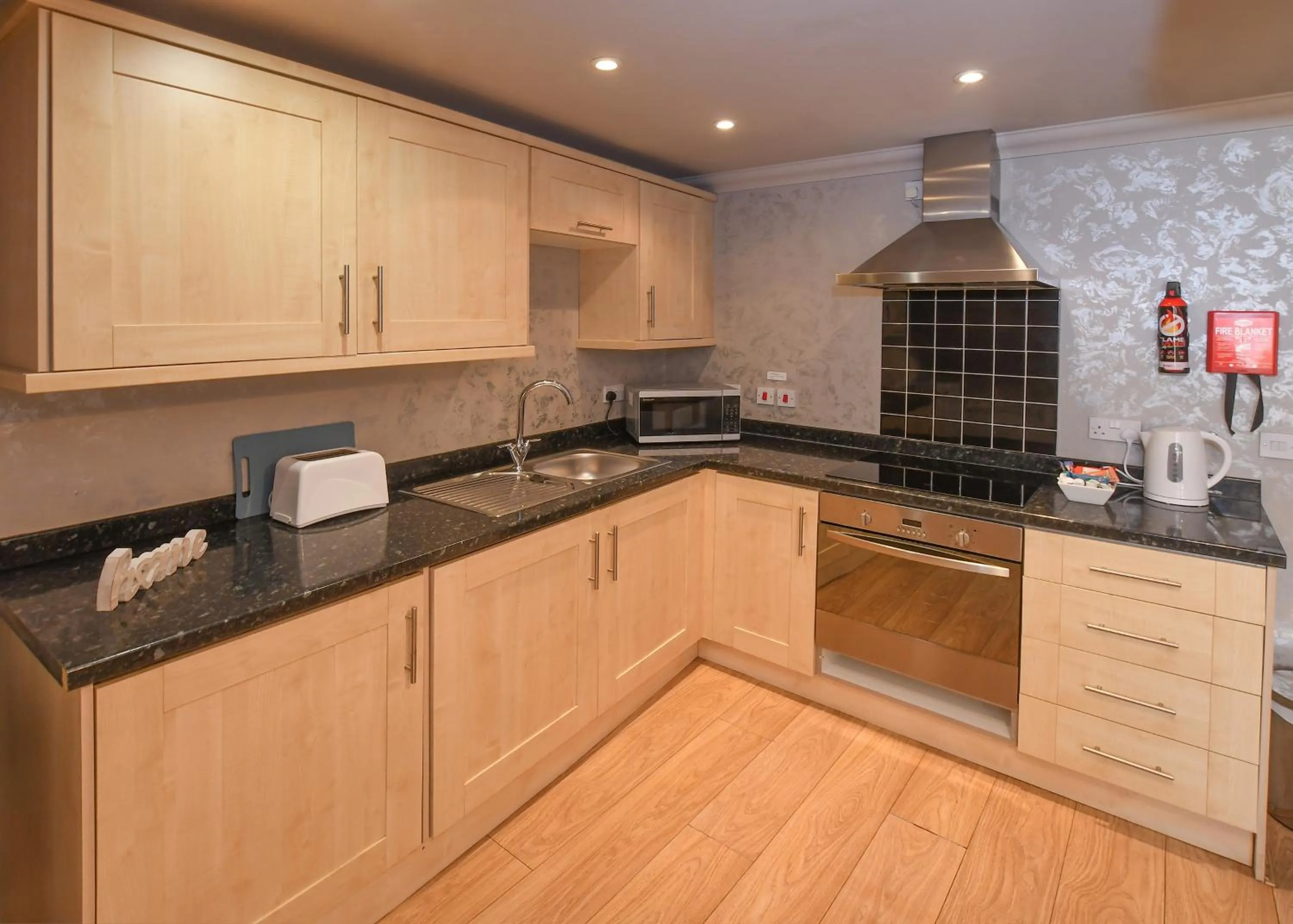 Kitchen or kitchenette in The Queens Hotel & Victoria Cloisters Apartments