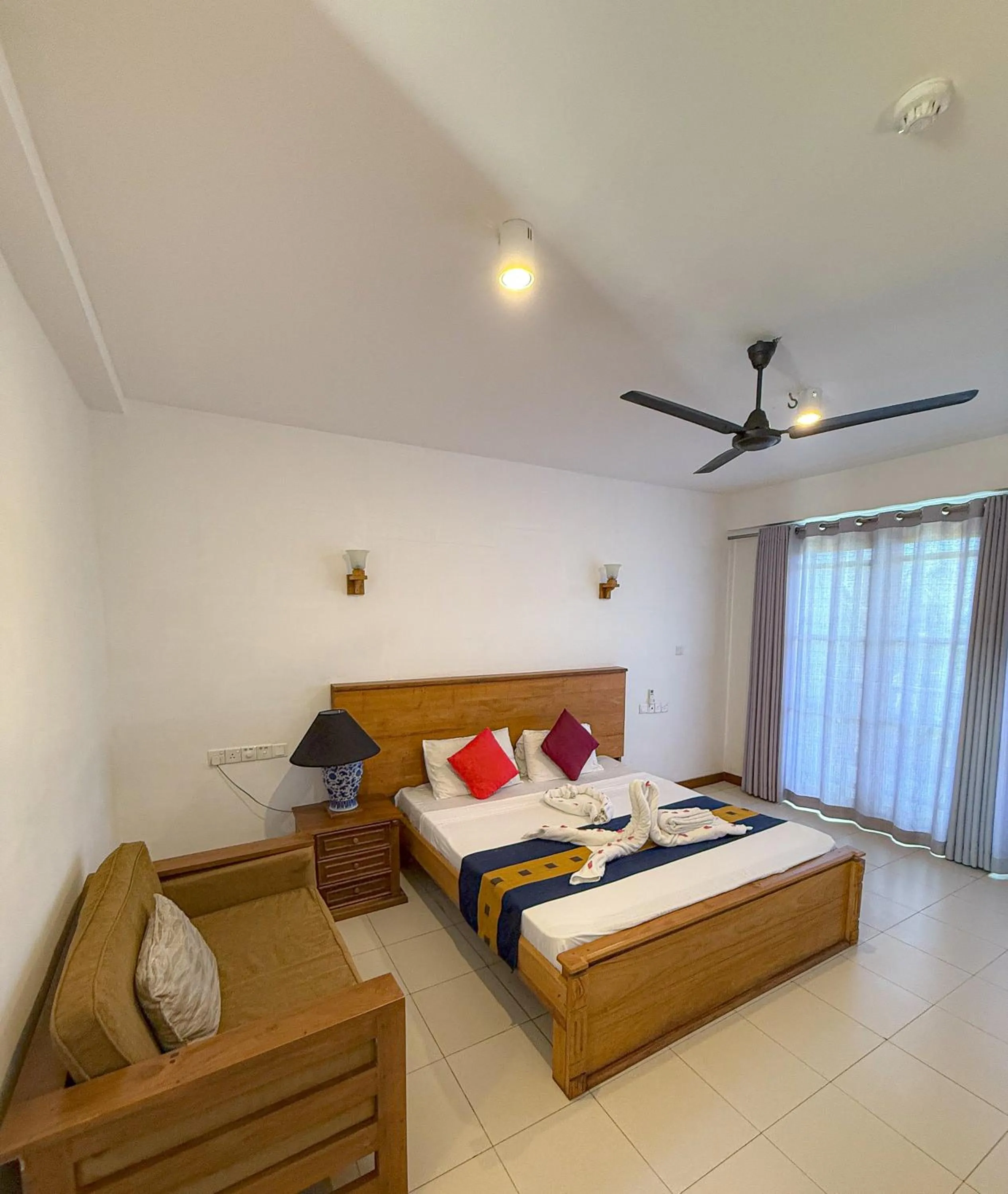 Bed in Serendib Beach Hotel