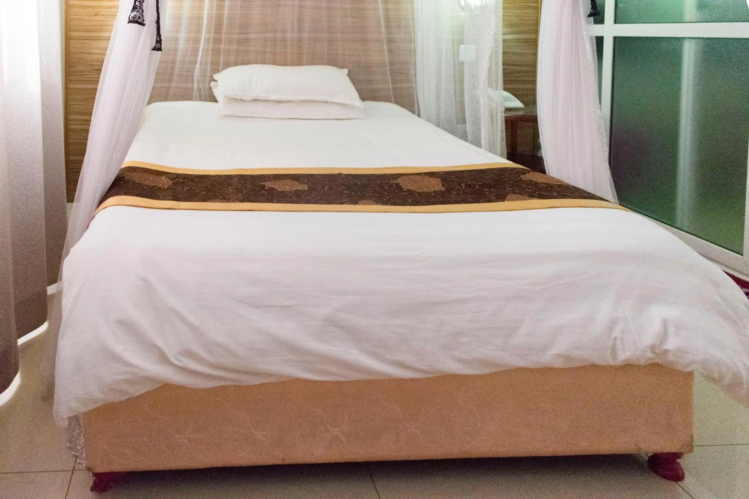 Bed in Remmings Hotel Kampala