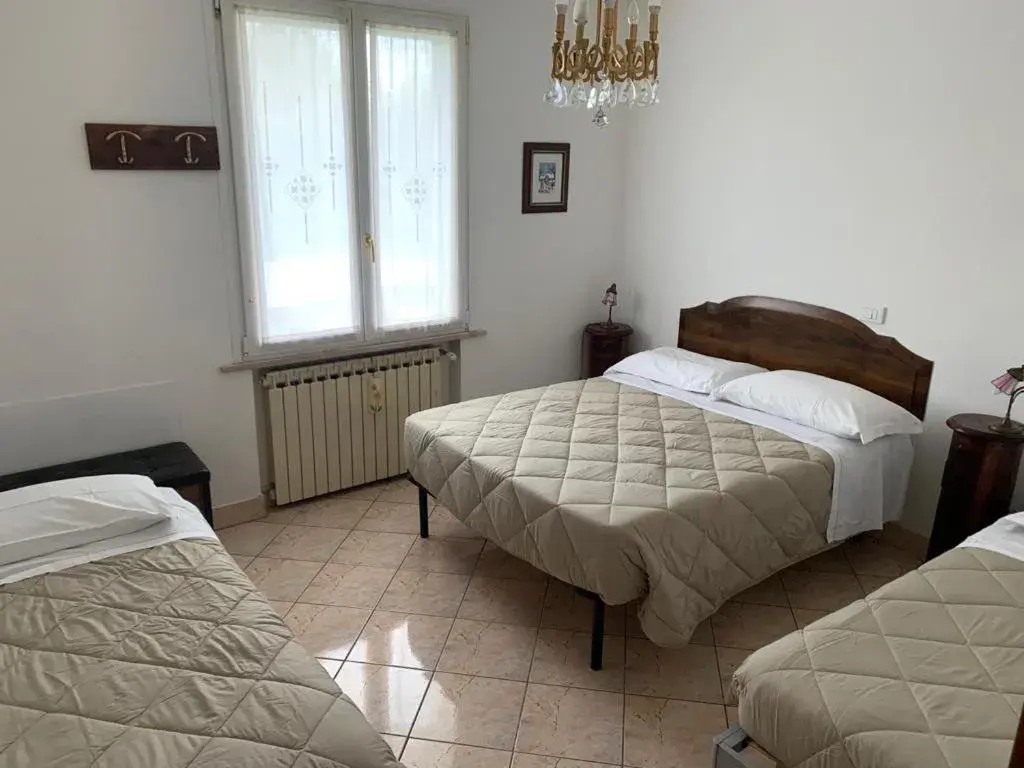 Triple Room with Garden View in Ca' Le Rose Triple Room with Garden View in Ca' Le Rose