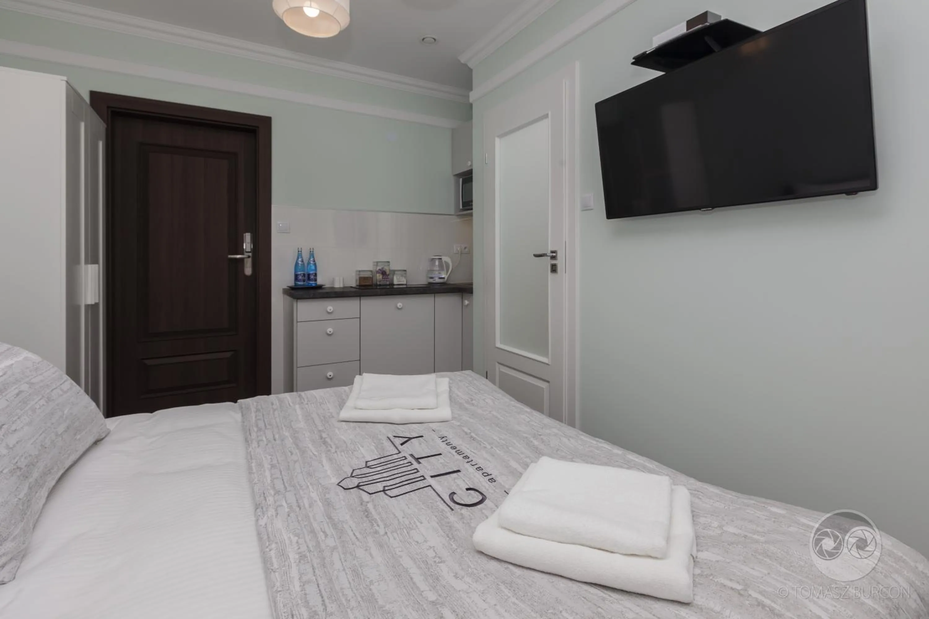 TV and multimedia, Bed in Apartamenty City.