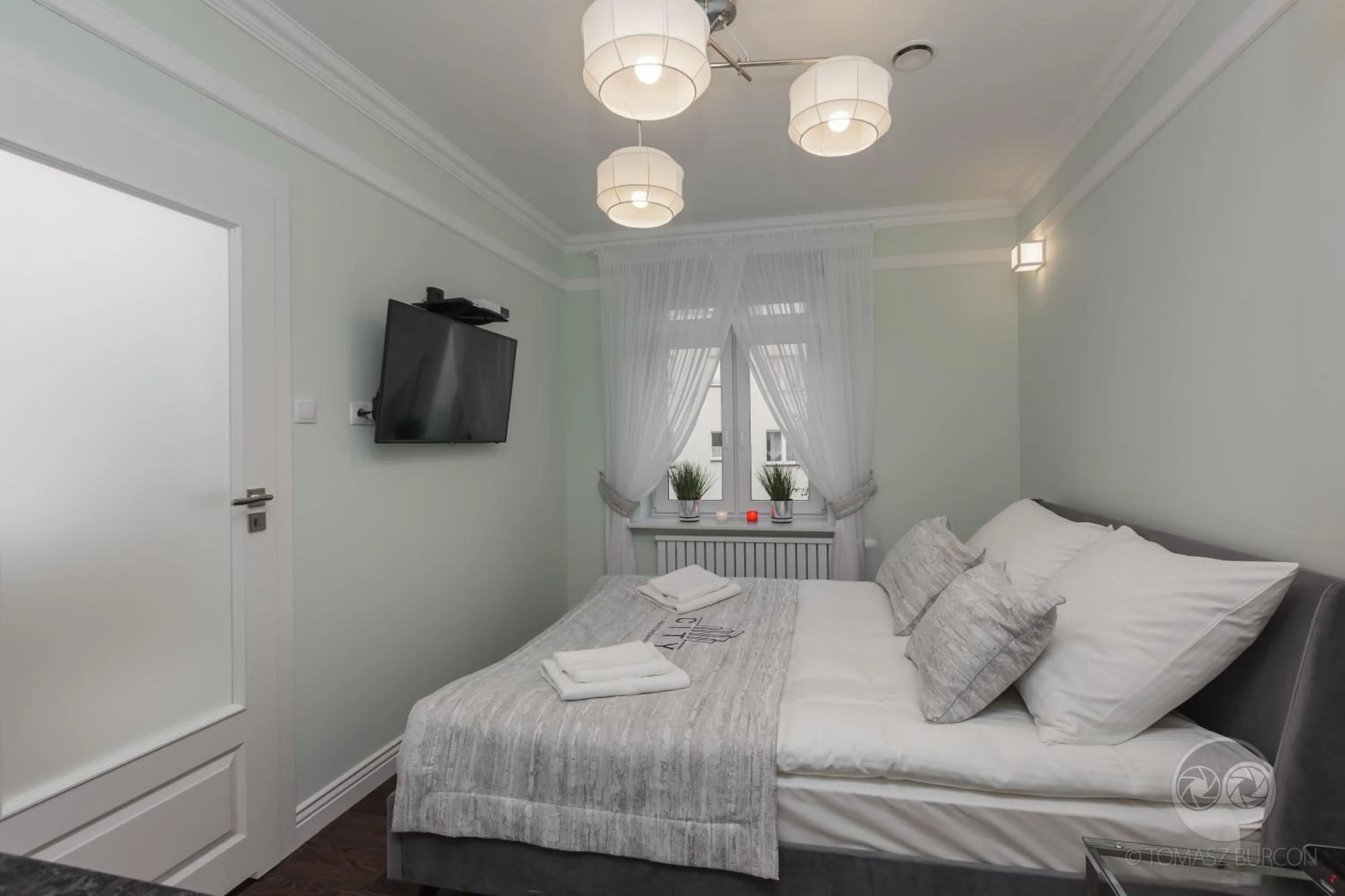 TV and multimedia, Bed in Apartamenty City.
