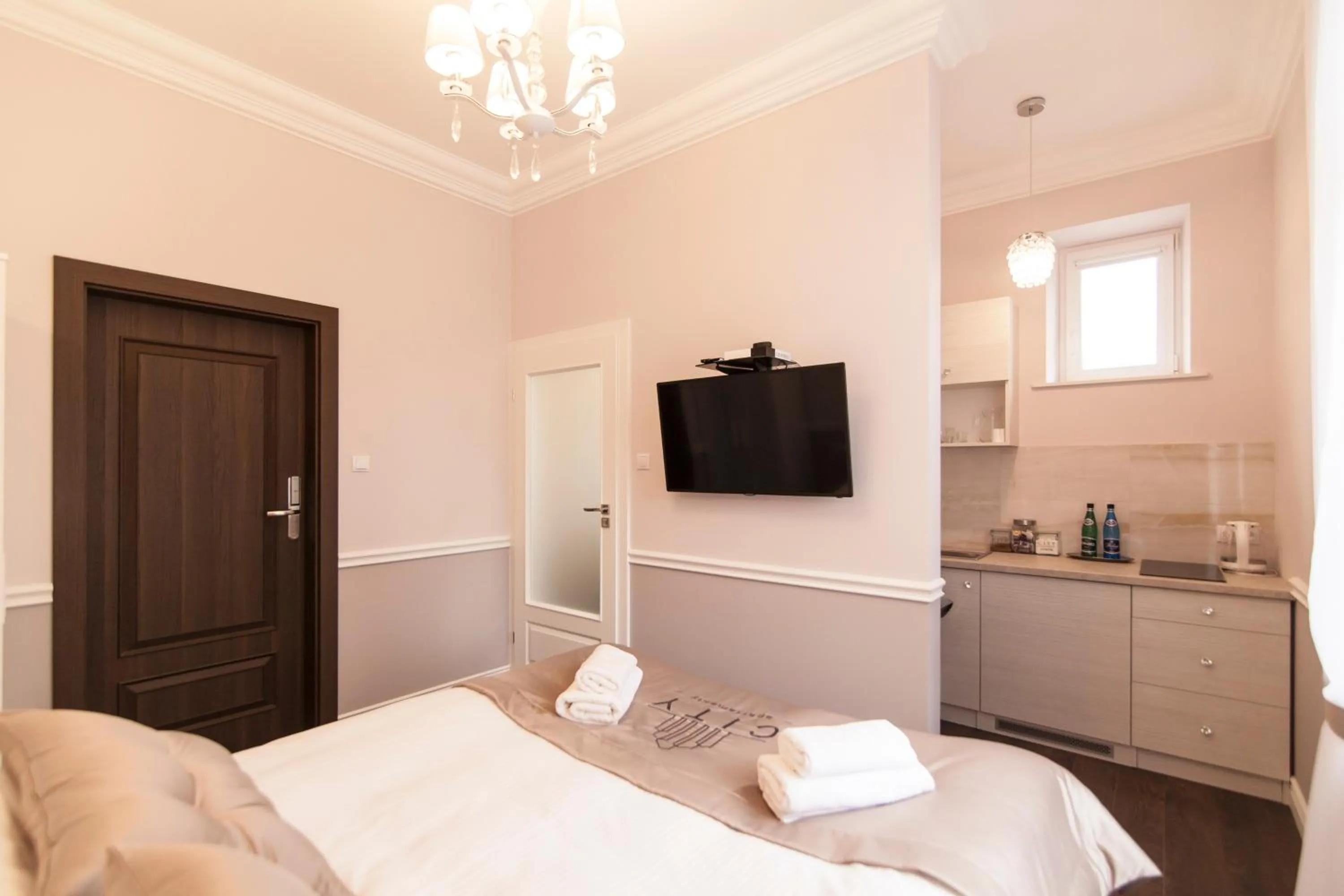 TV and multimedia, Bed in Apartamenty City.