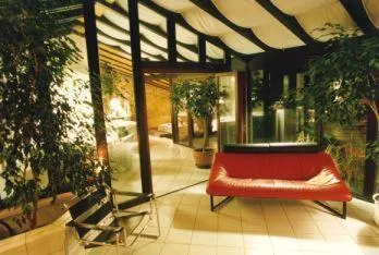 Communal lounge/ TV room in L'Auberge