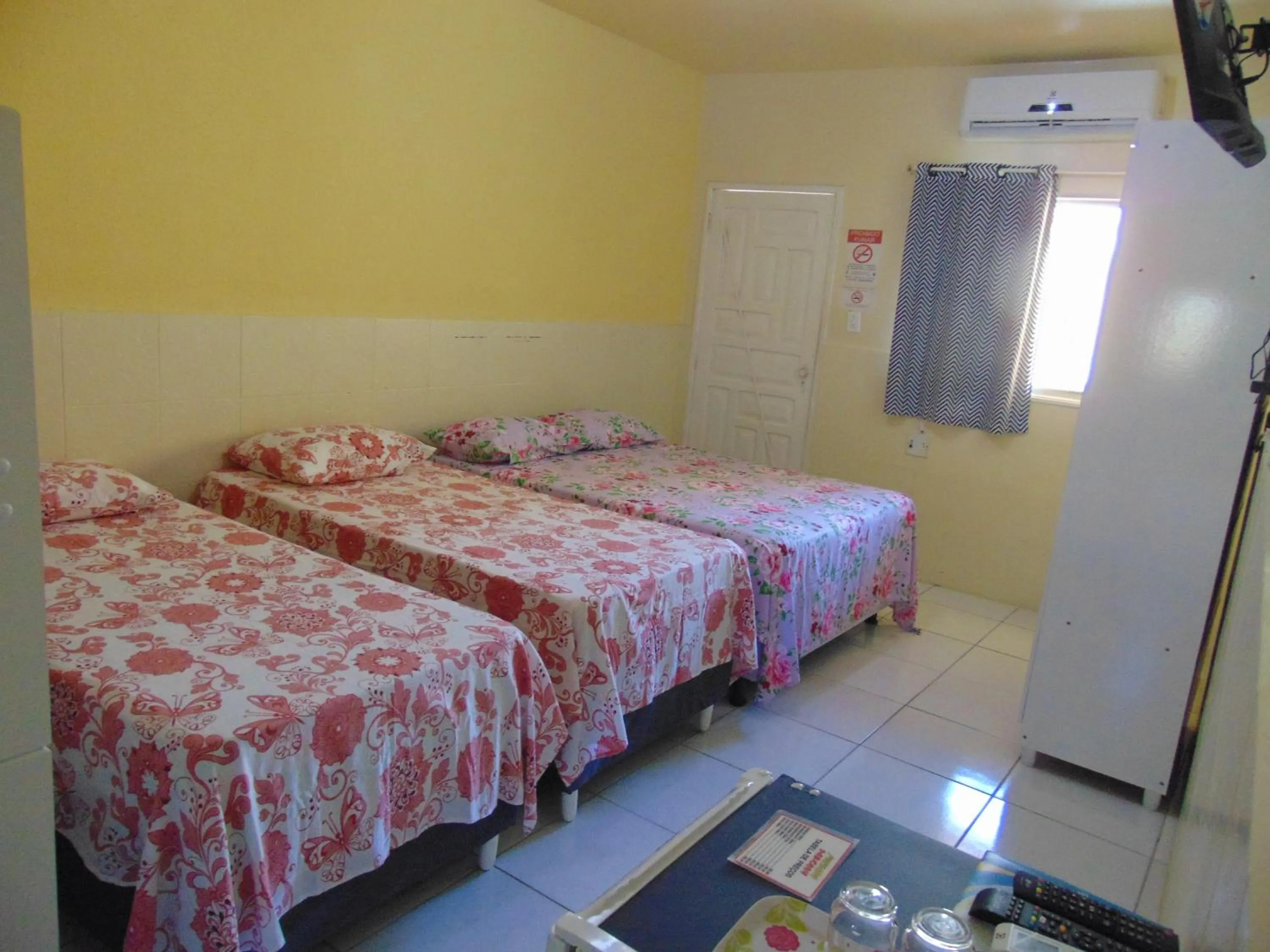 Bed in Pousada Sabrinna