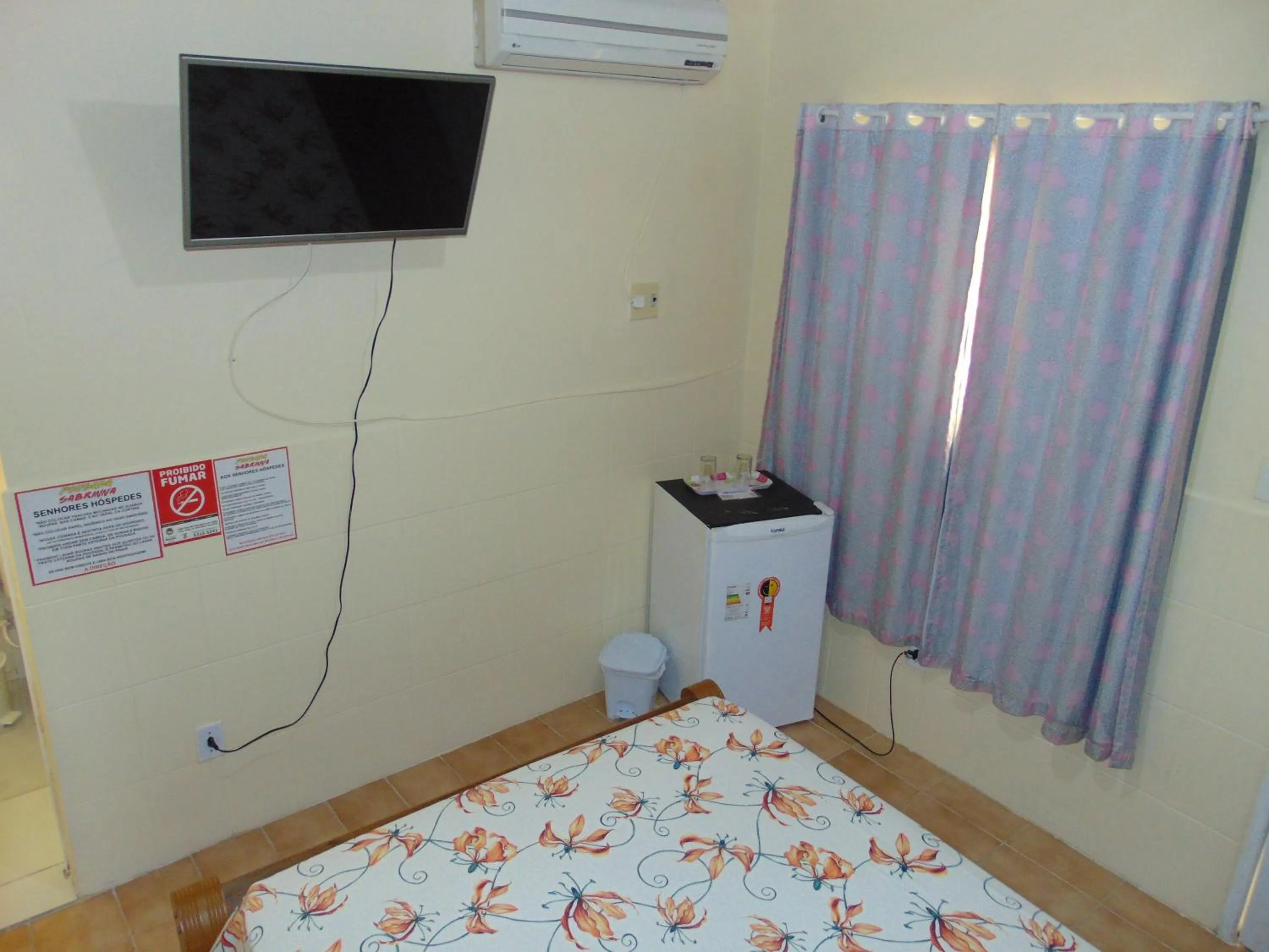 Bed in Pousada Sabrinna