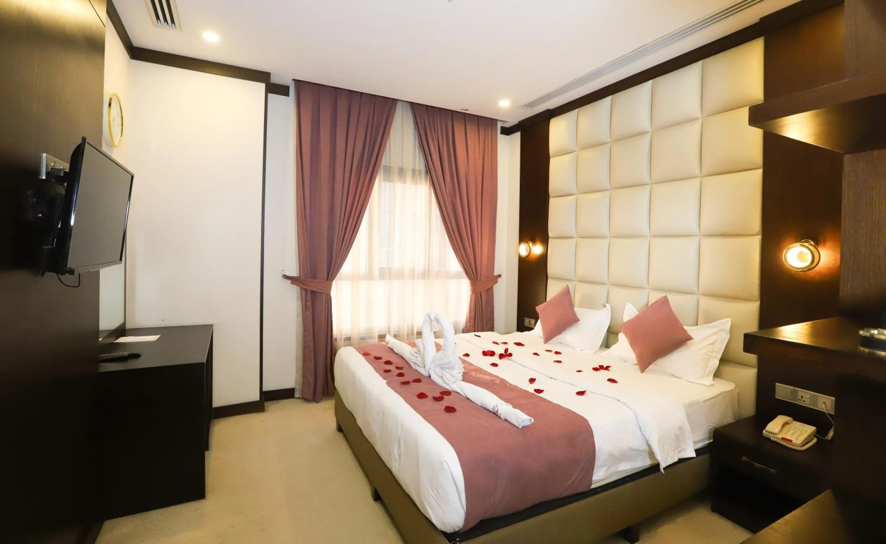 Bed in Paris Plaza Hotel