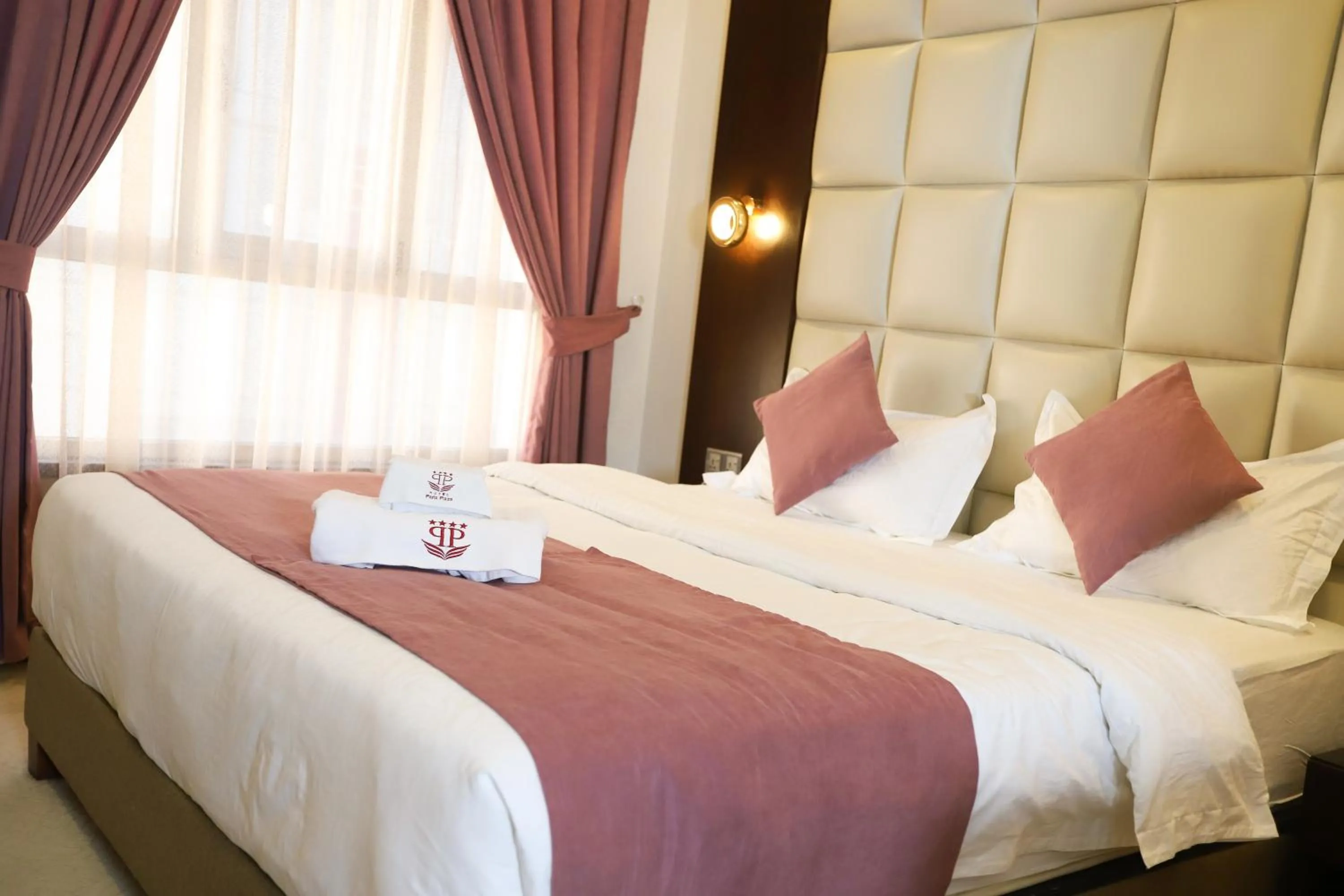 Bed in Paris Plaza Hotel