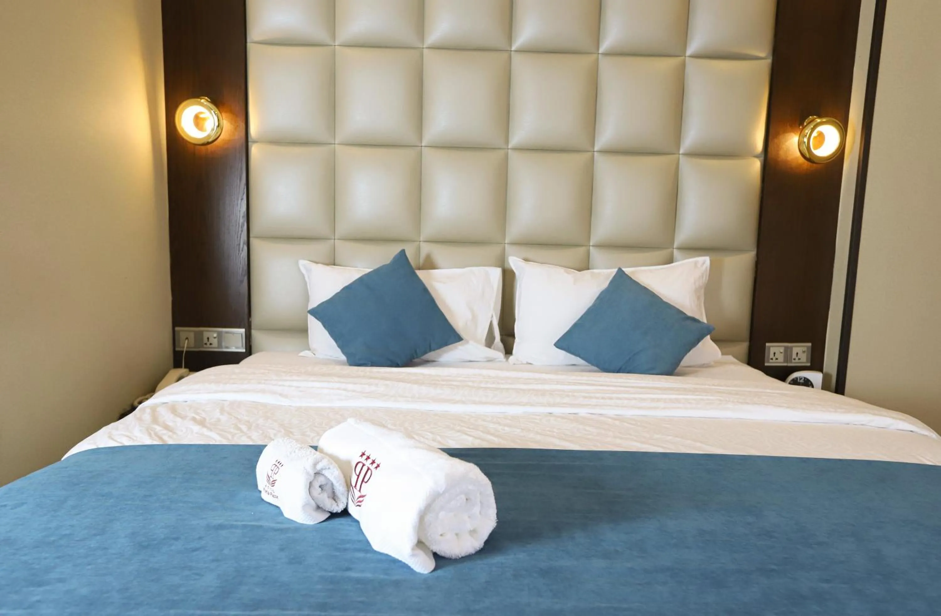 Bed in Paris Plaza Hotel