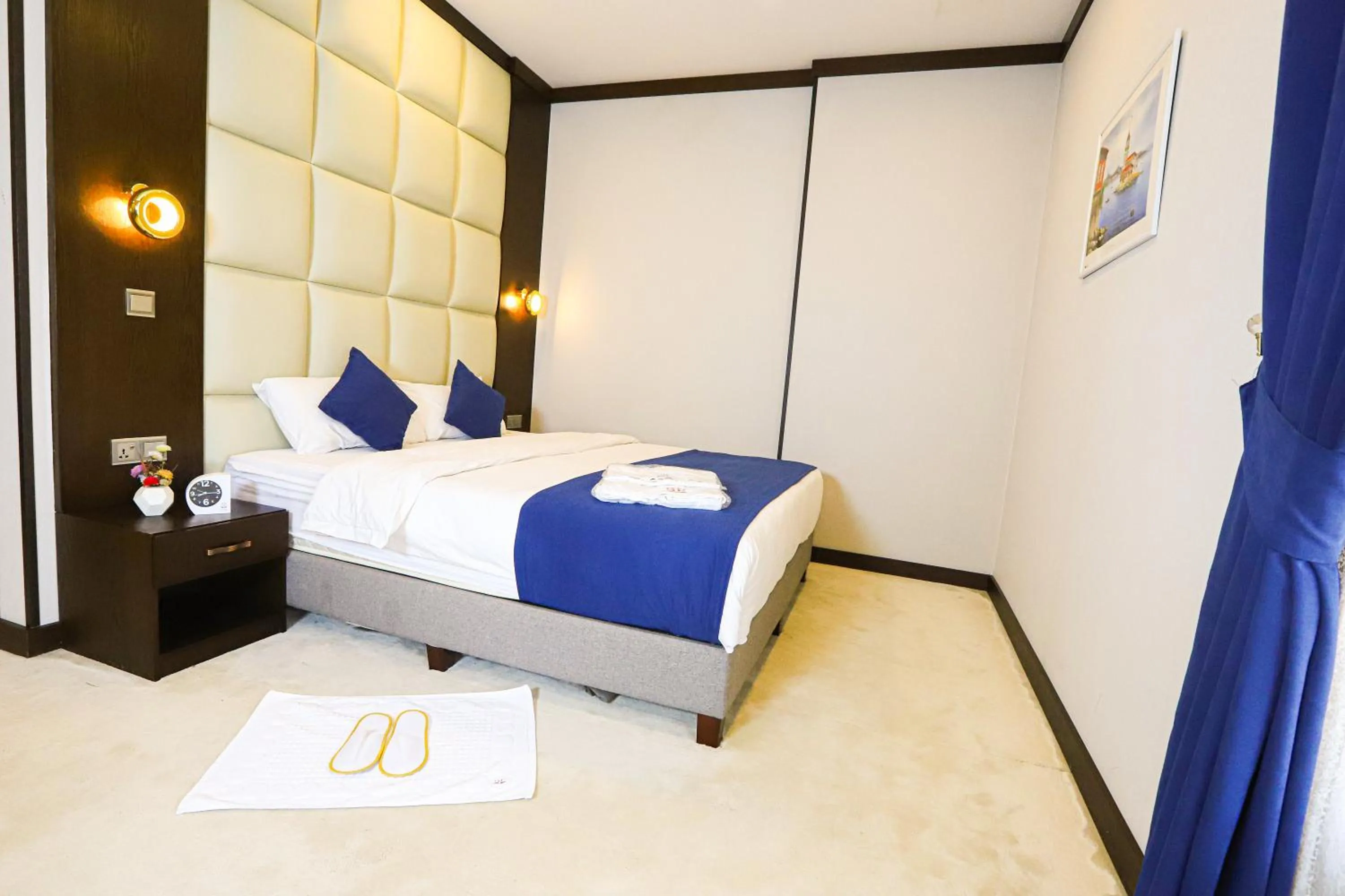 Bed in Paris Plaza Hotel