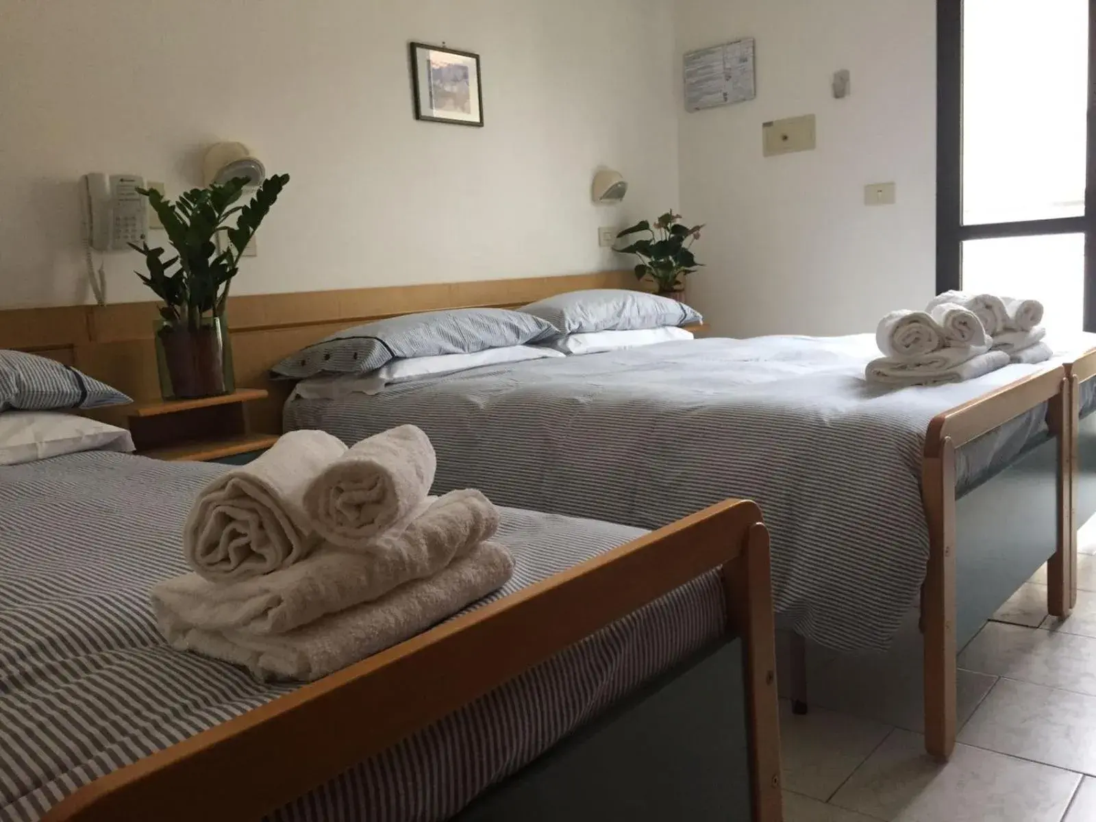 Bed in Hotel Riziana