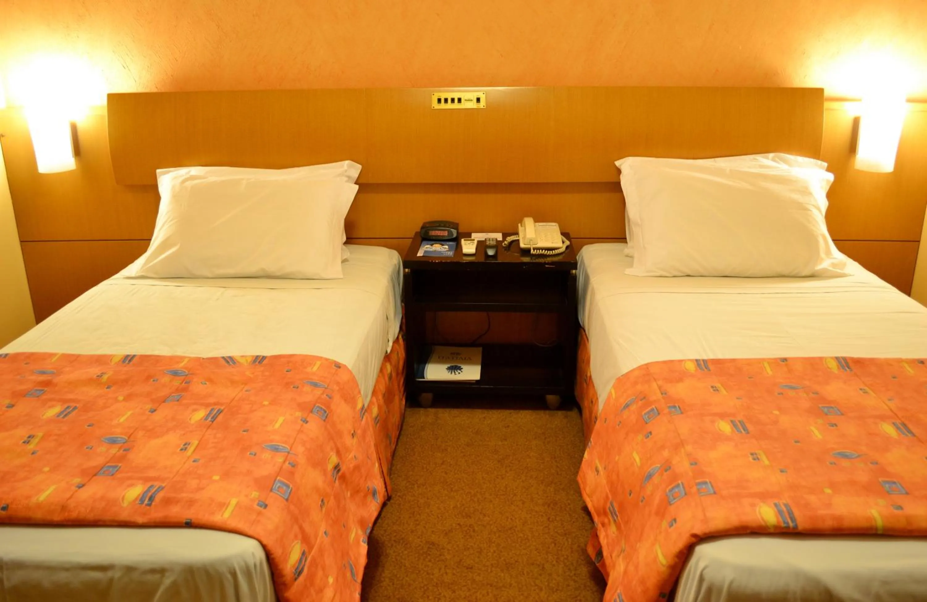 Bed in Itatiaia Hotel Passo Fundo