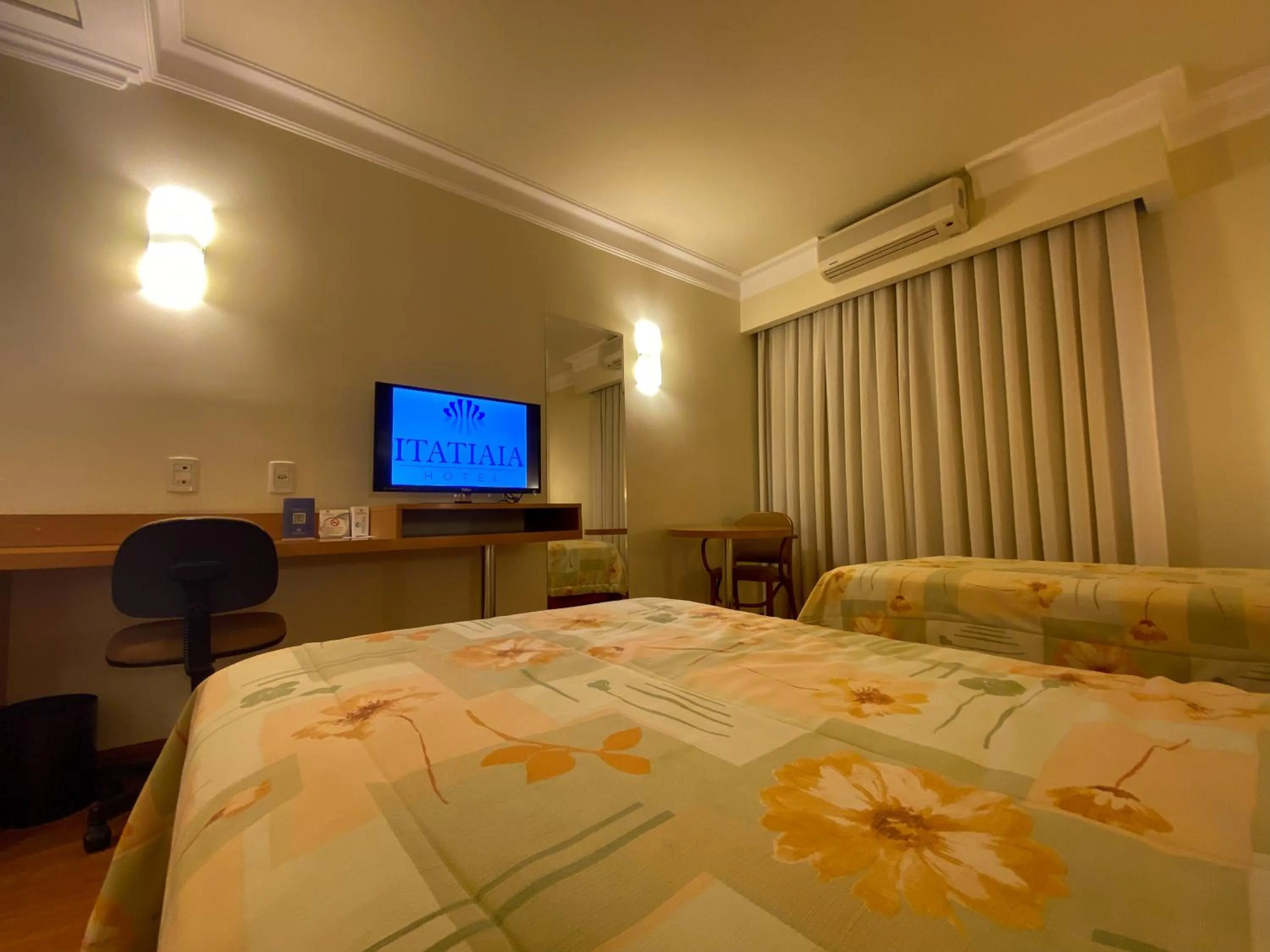 Bed in Itatiaia Hotel Passo Fundo