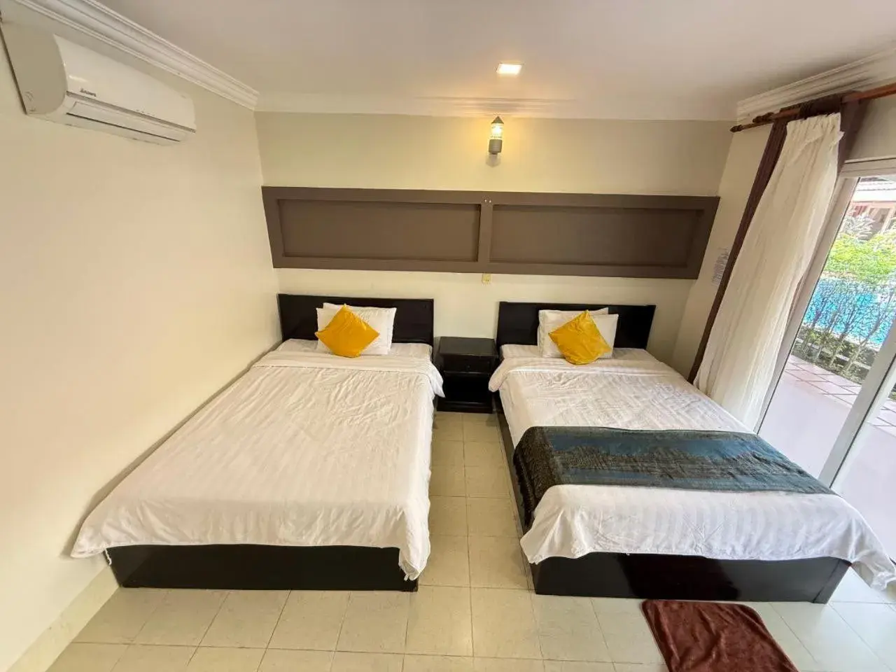 Bed in Hello Kampot Resort Bed in Hello Kampot Resort