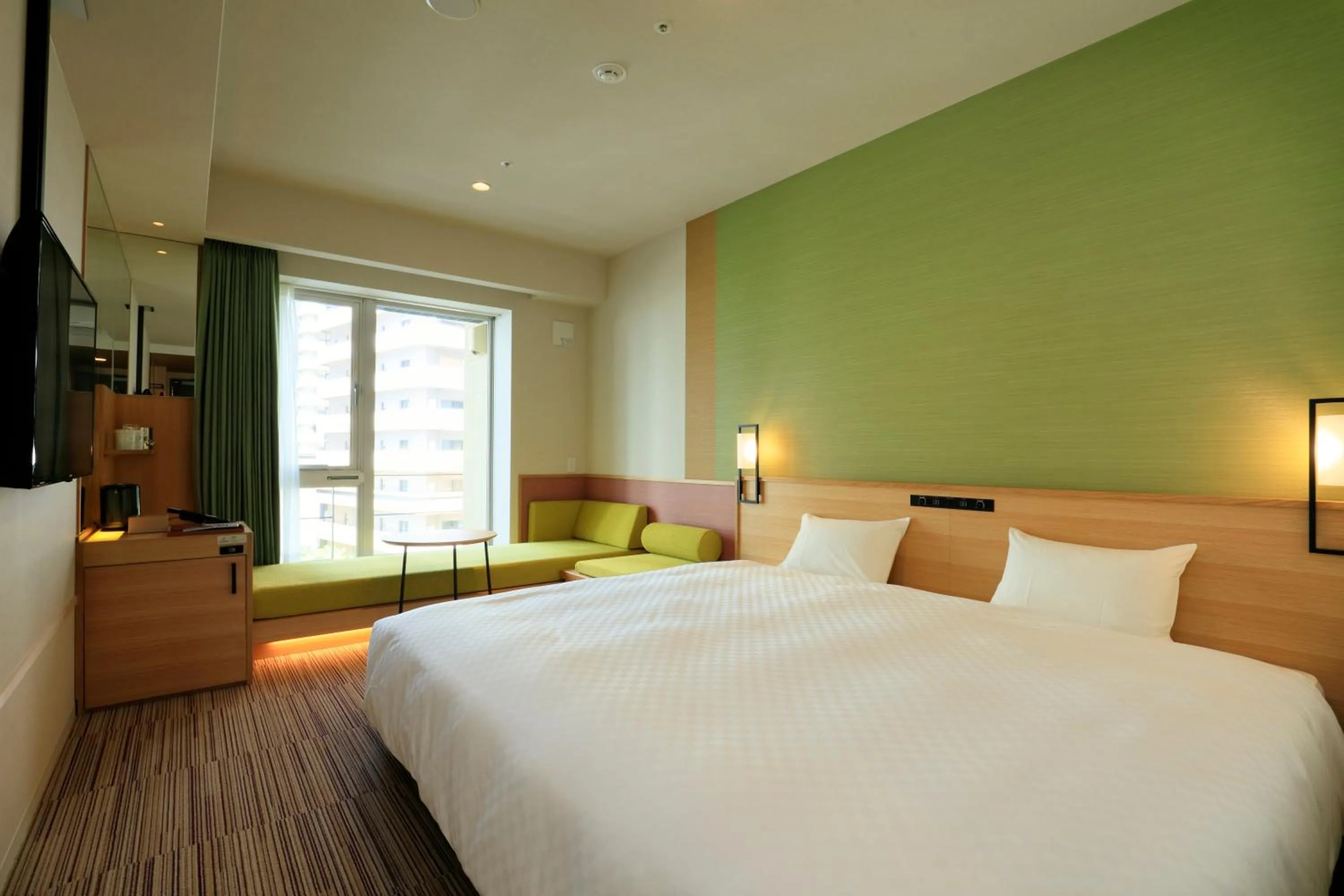 Bed in THE SINGULARI HOTEL & SKYSPA at UNIVERSAL STUDIOS JAPAN