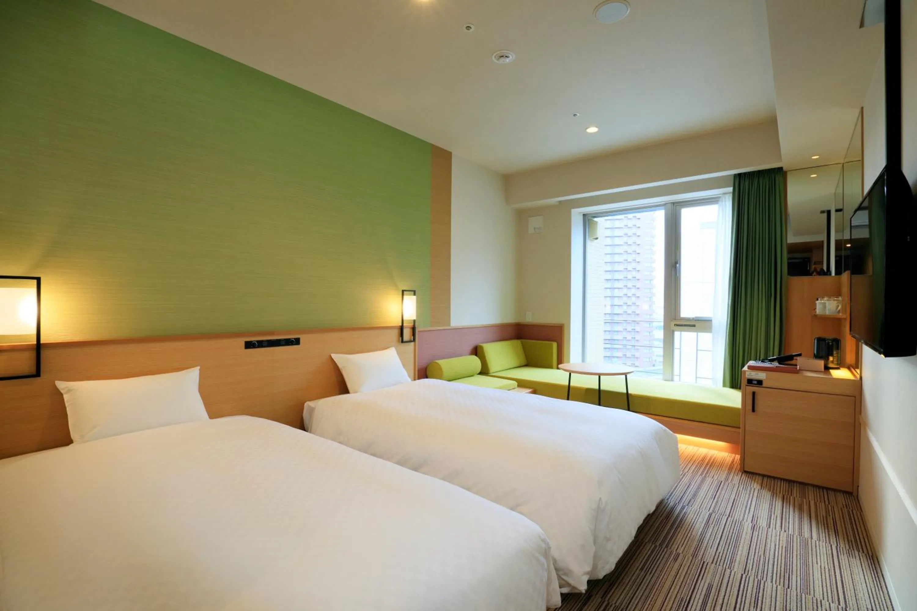 Bed in THE SINGULARI HOTEL & SKYSPA at UNIVERSAL STUDIOS JAPAN