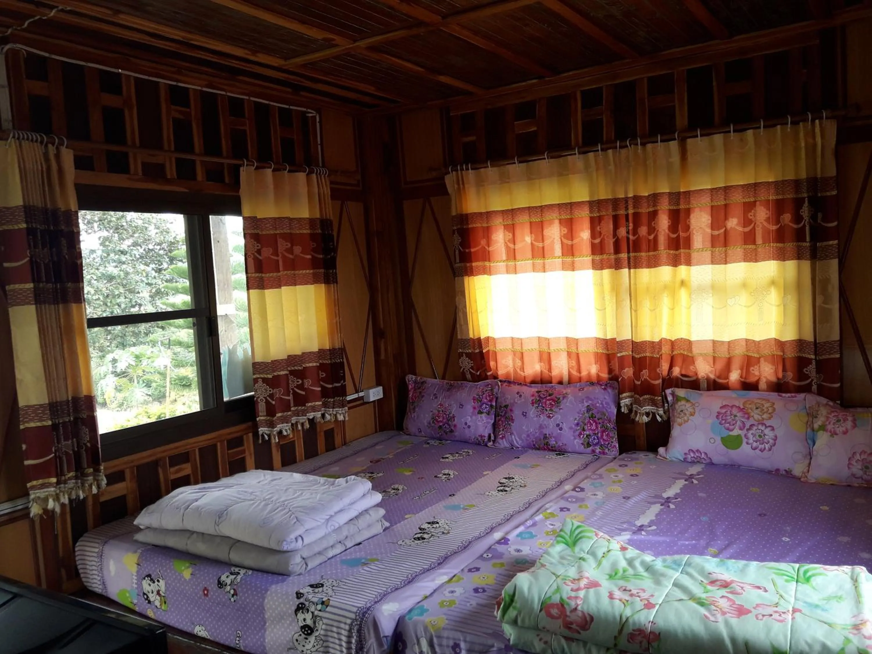 Bed in Phu Aram Khao Kho Resort