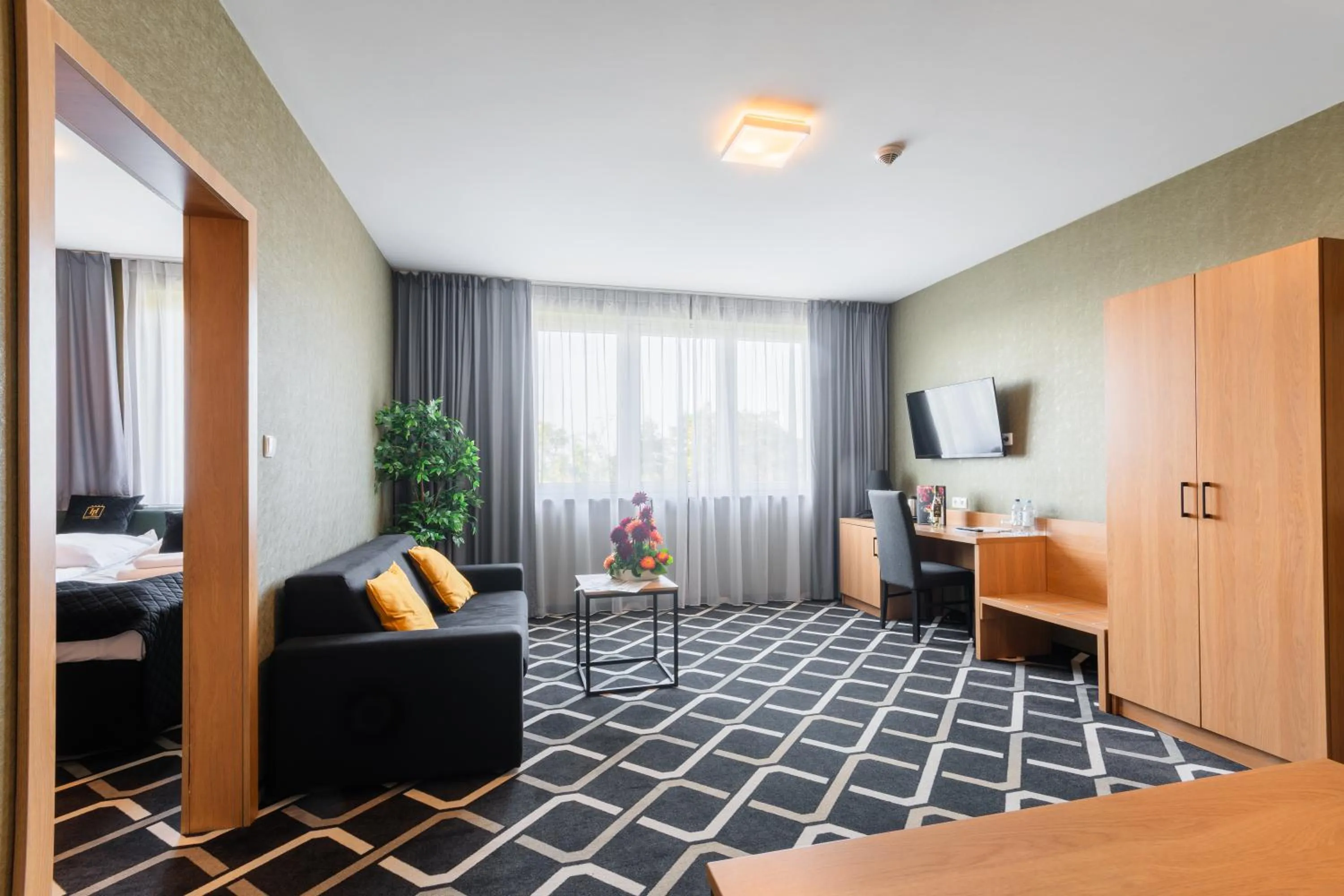 Bed in Hotel Lantier & Swimming Pool Zone