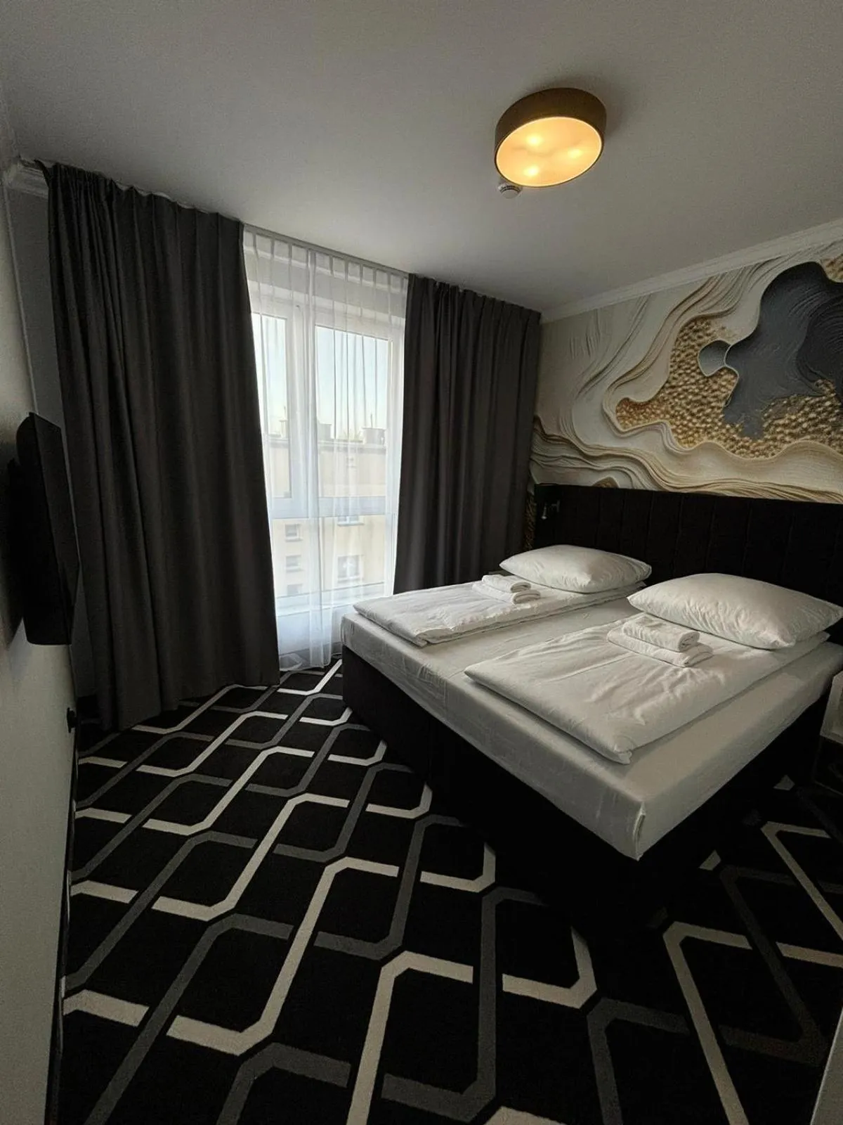 Bed in Hotel Lantier & Swimming Pool Zone