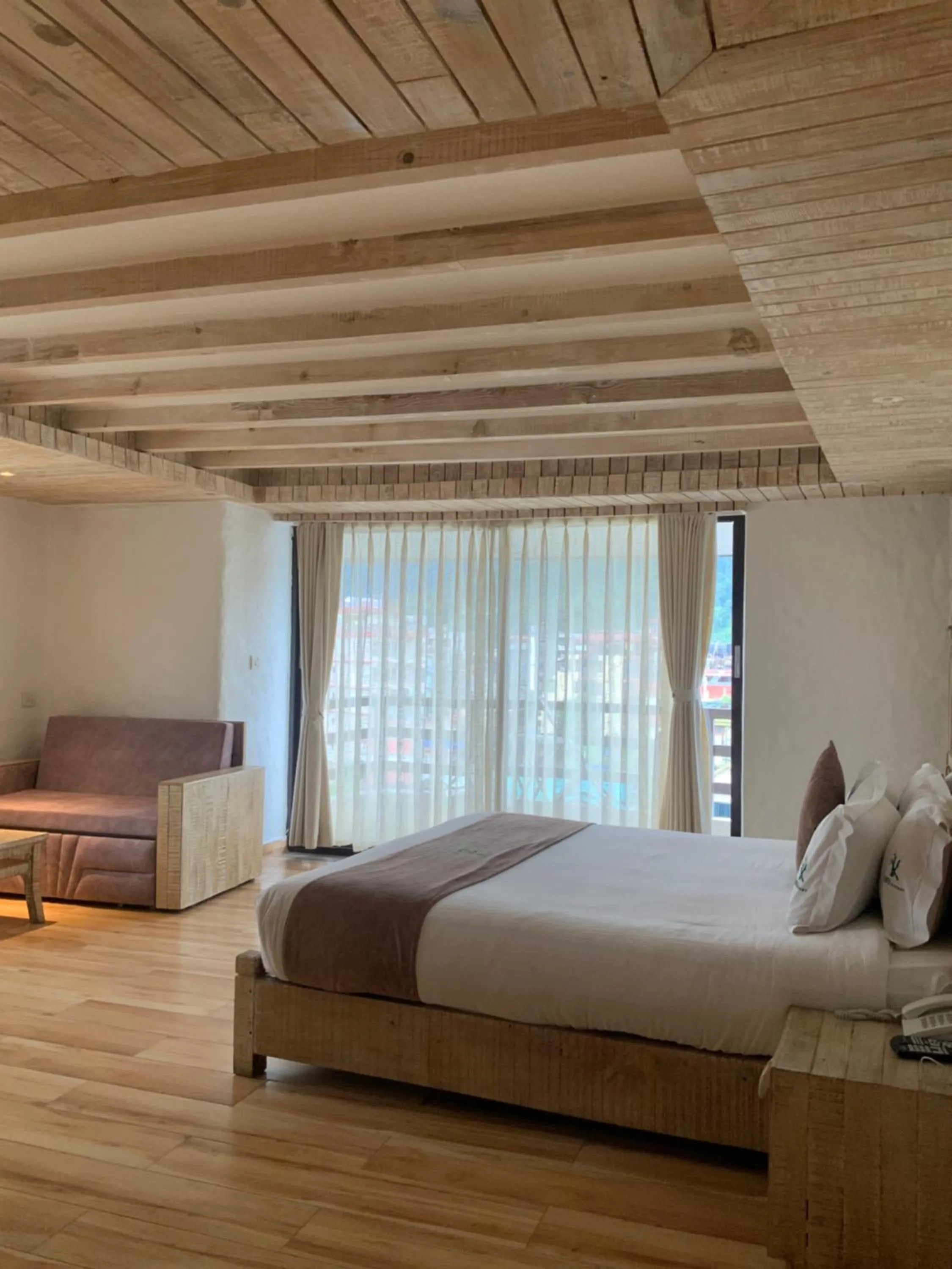 Bed in Kuti Resort & Spa