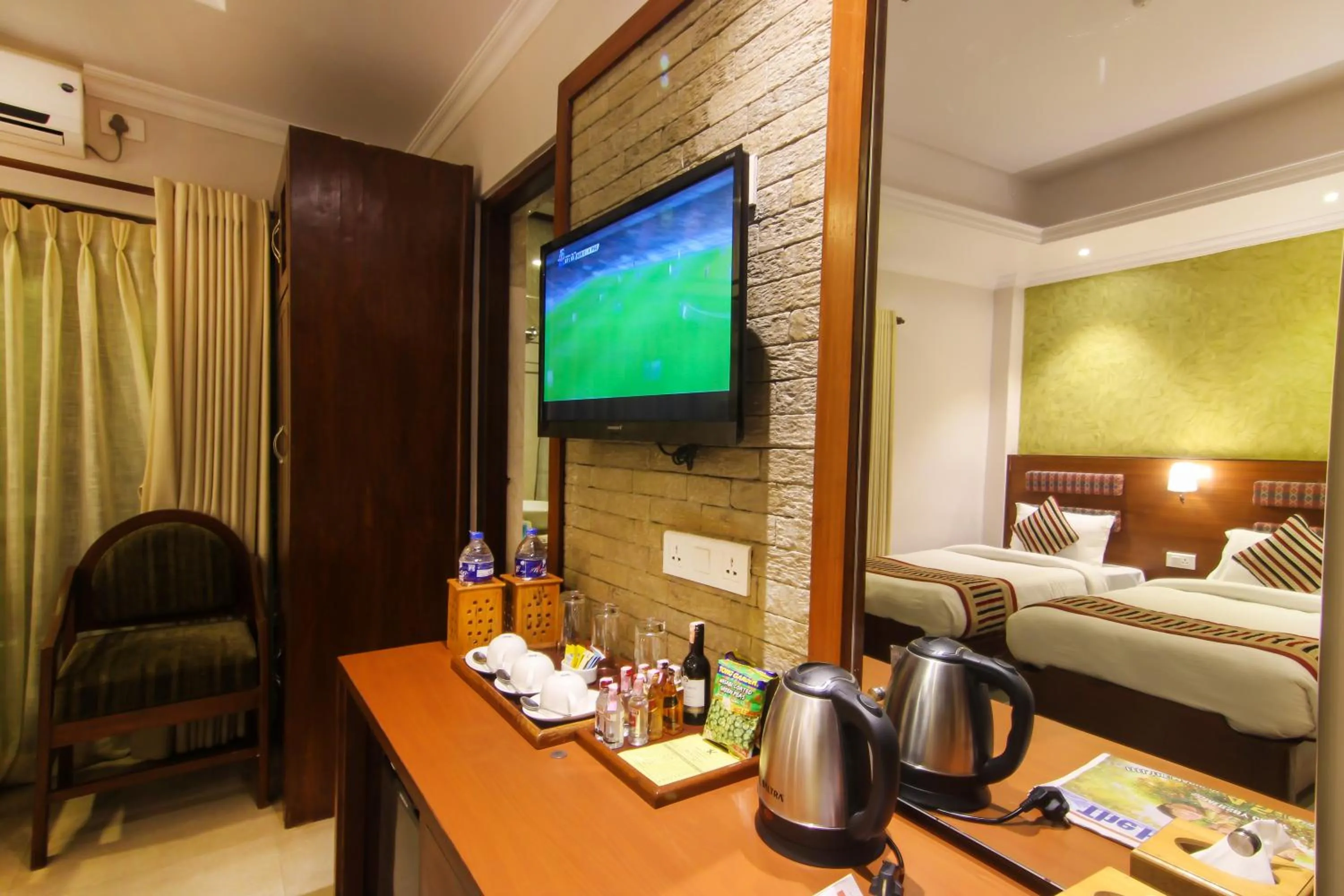 Communal lounge/ TV room, Bed in Kuti Resort & Spa