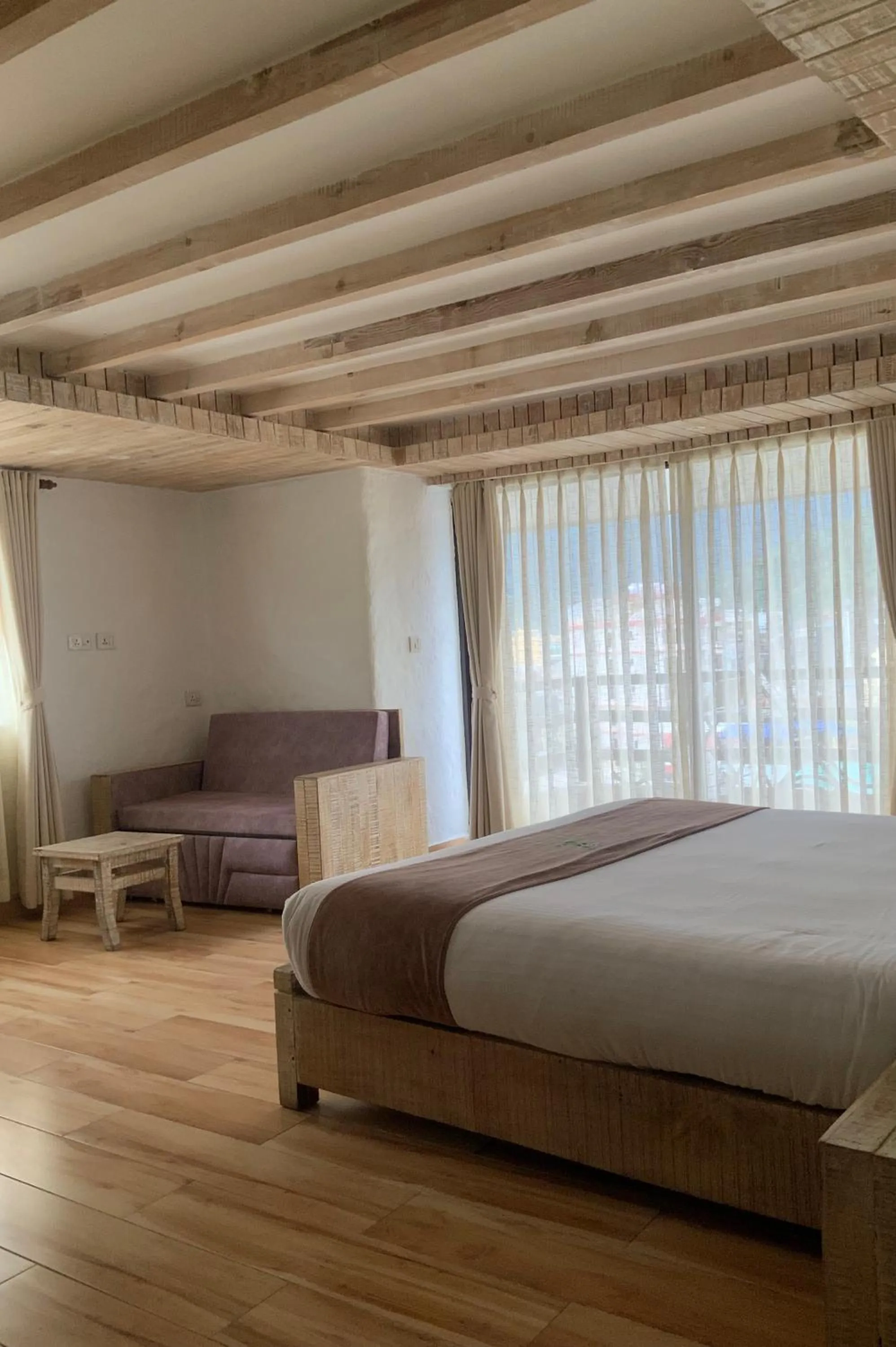 Bed in Kuti Resort & Spa