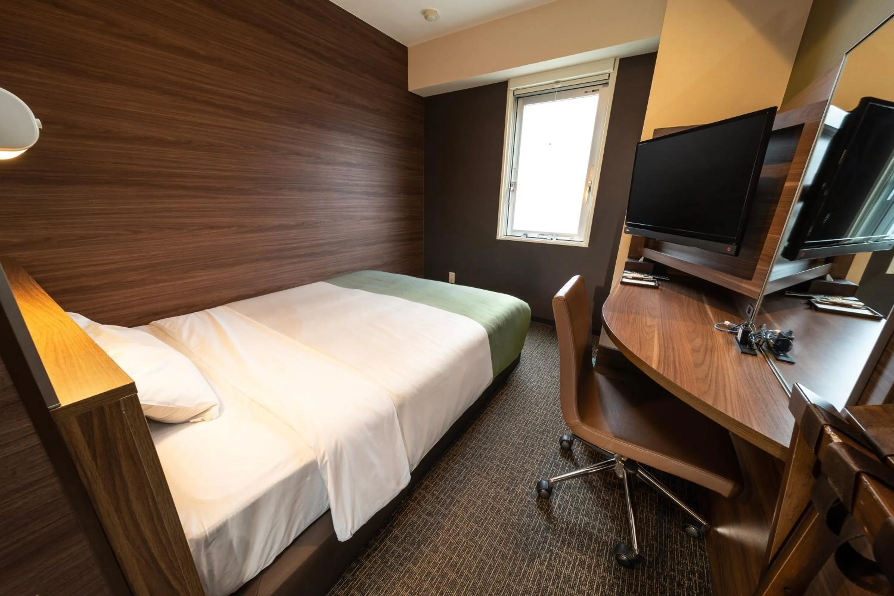 Bed in Super Hotel Mito