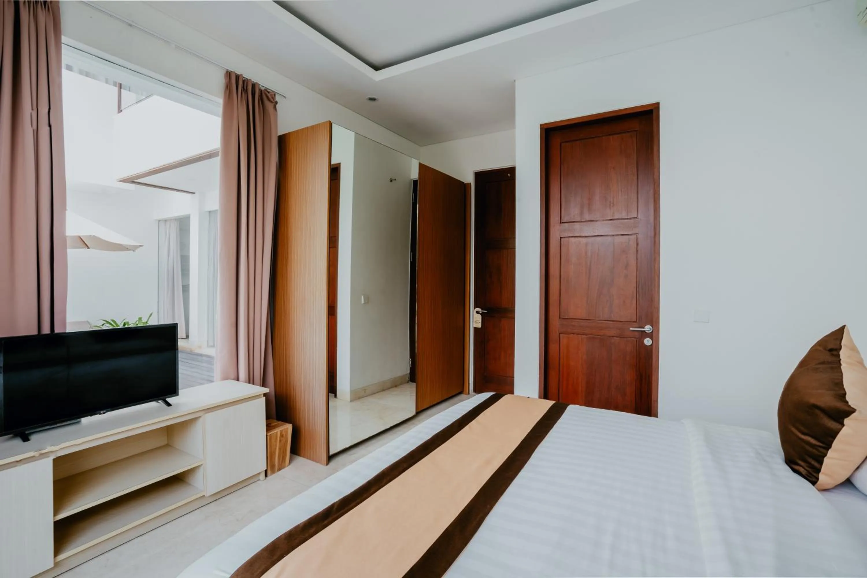 Communal lounge/ TV room, Bed in Bali Residence Villa