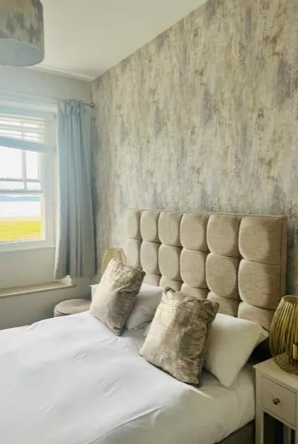 Bed in The Commodore Inn