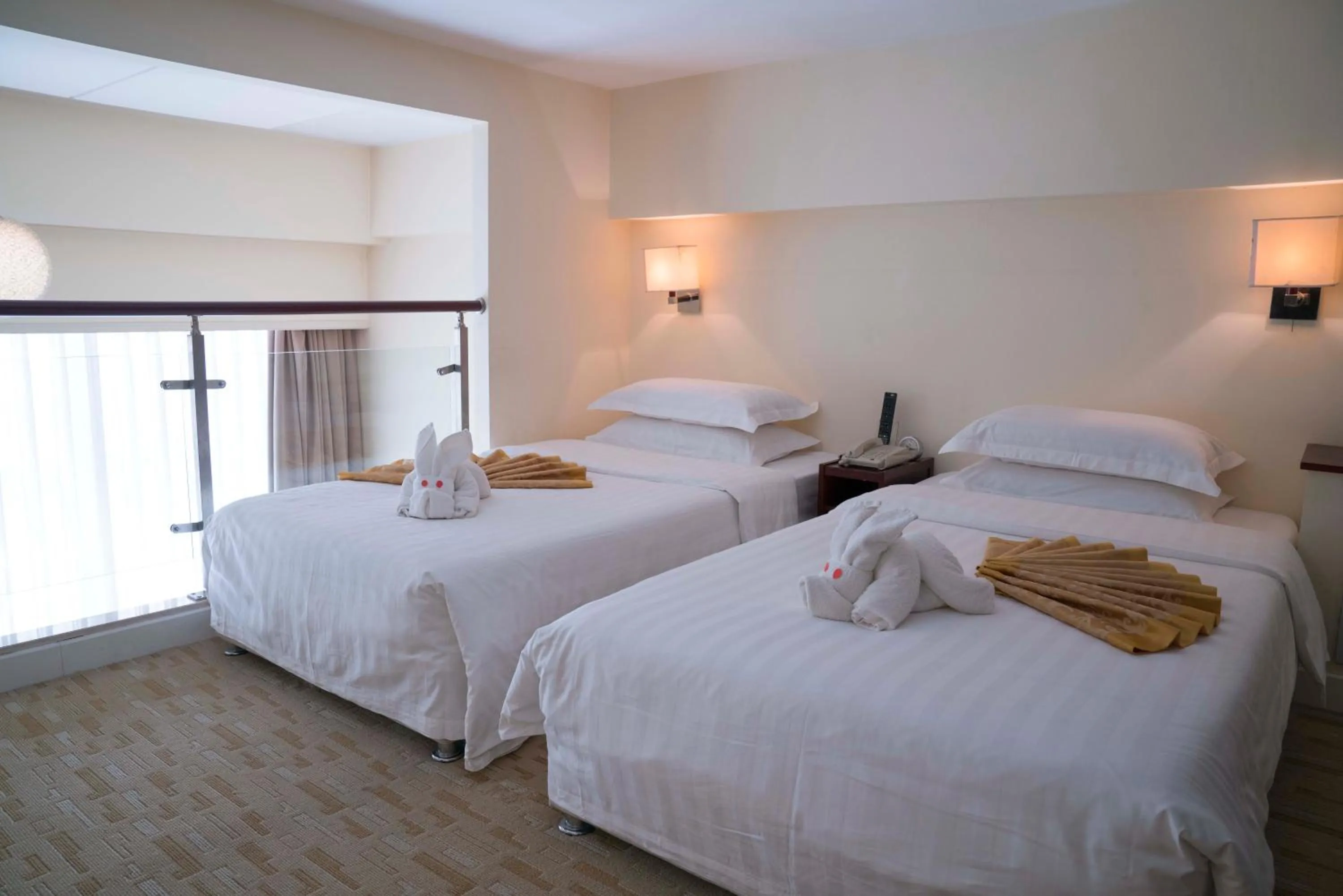 Bed in Yantai Meiya International ApartHotel (Previous Ramada Plaza)