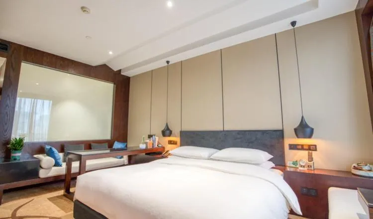 Bed in Yantai Meiya International ApartHotel (Previous Ramada Plaza)