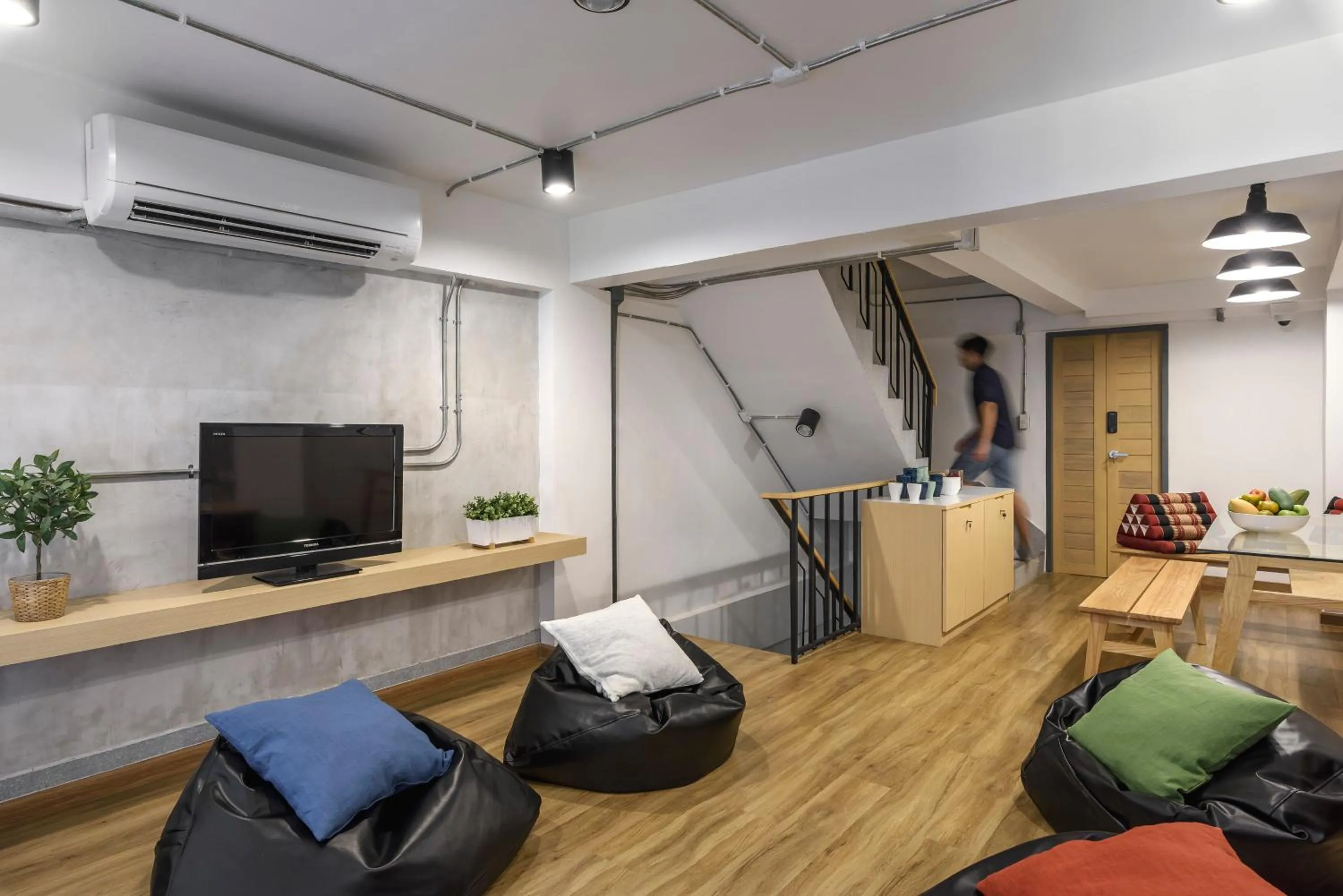 Communal lounge/ TV room in ORA Hostel Bangkok