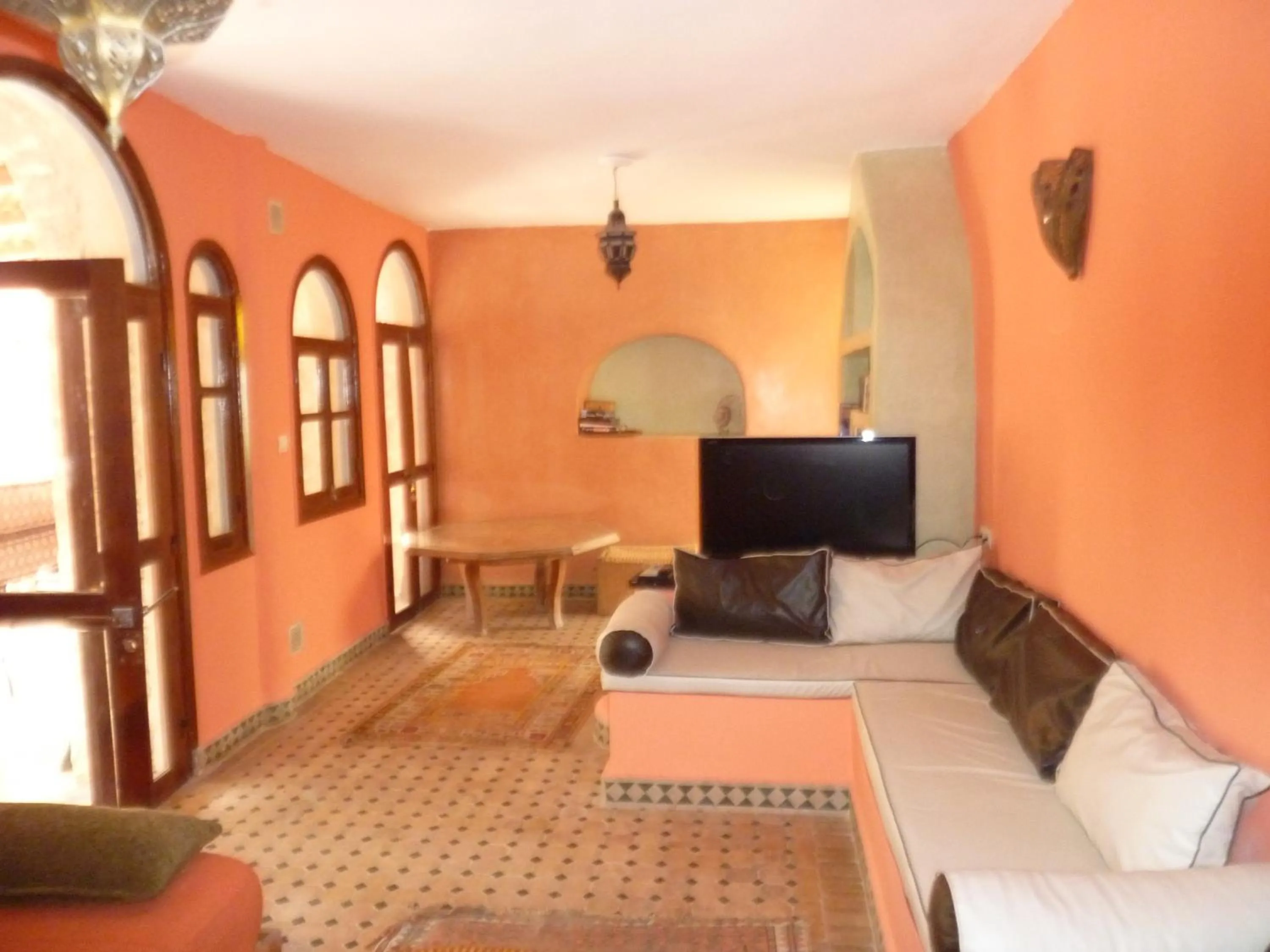 Communal lounge/ TV room, Bed in Villa Grenadine